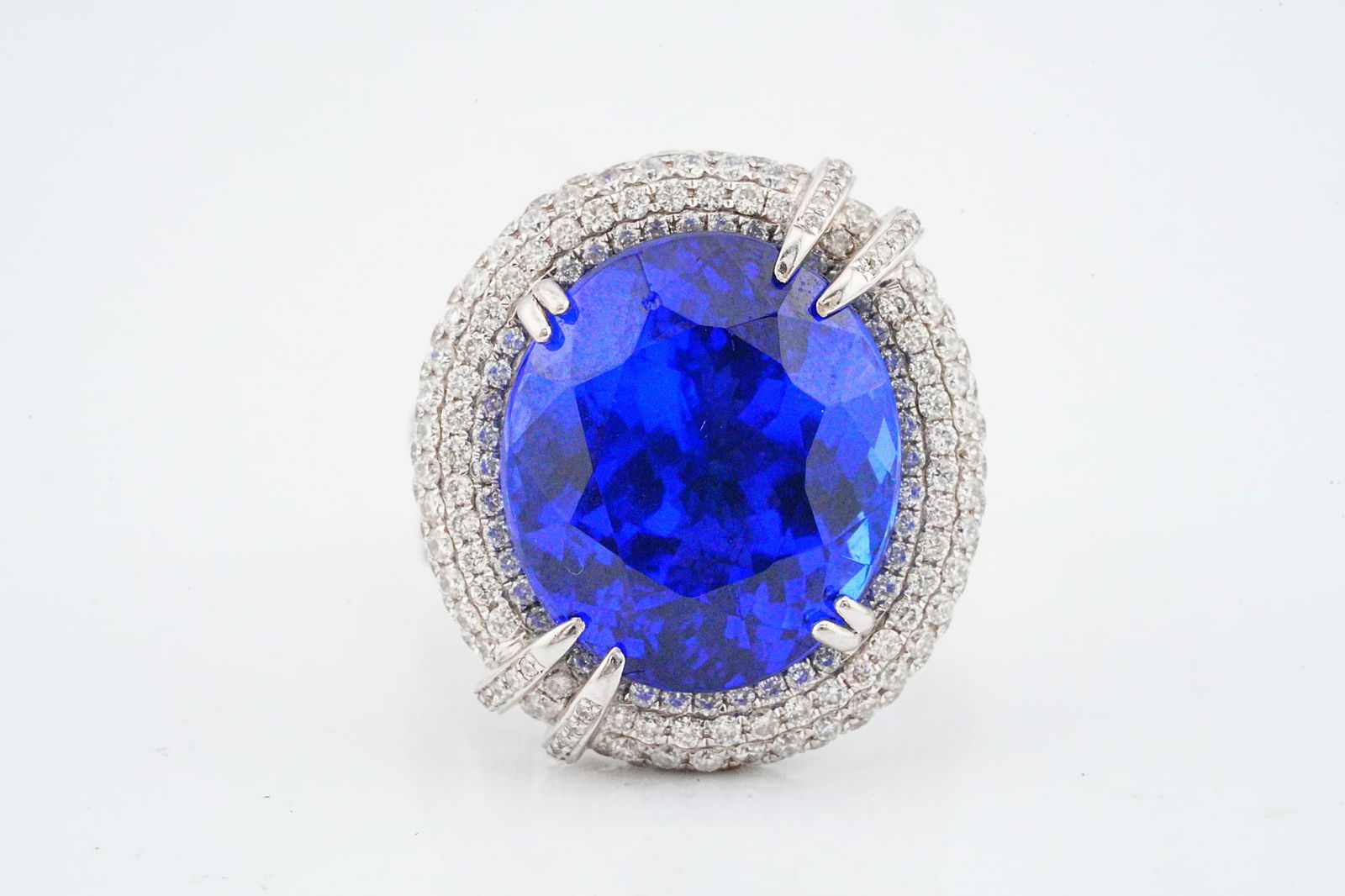 19.65ct Tanzanite, 2.40ctw Diamond, 18K Ring/Pendant: 19.65ct Tanzanite, 2.40ctw VS1-SI1/G-H Diamond and 18K White Gold Convertible Ring/Pendant - This item will come with a $54,000 insurance valuation report in the winning bidder's name. An extraordinar
