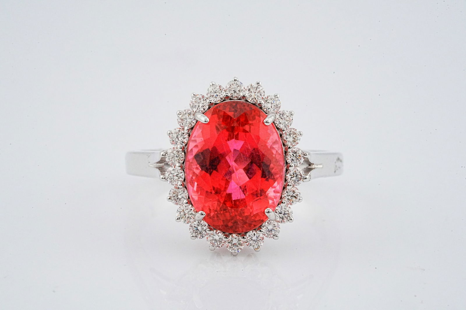 5.00ct Rubellite, 0.50ctw Diamond and 18K Ring: 5.00ct Rubellite Tourmaline, 0.50ctw VS2-SI1/G-H Diamond and 18K White Gold Ring - This item will come with a $12,000 insurance valuation report in the winning bidder's name. A stunning ring centered