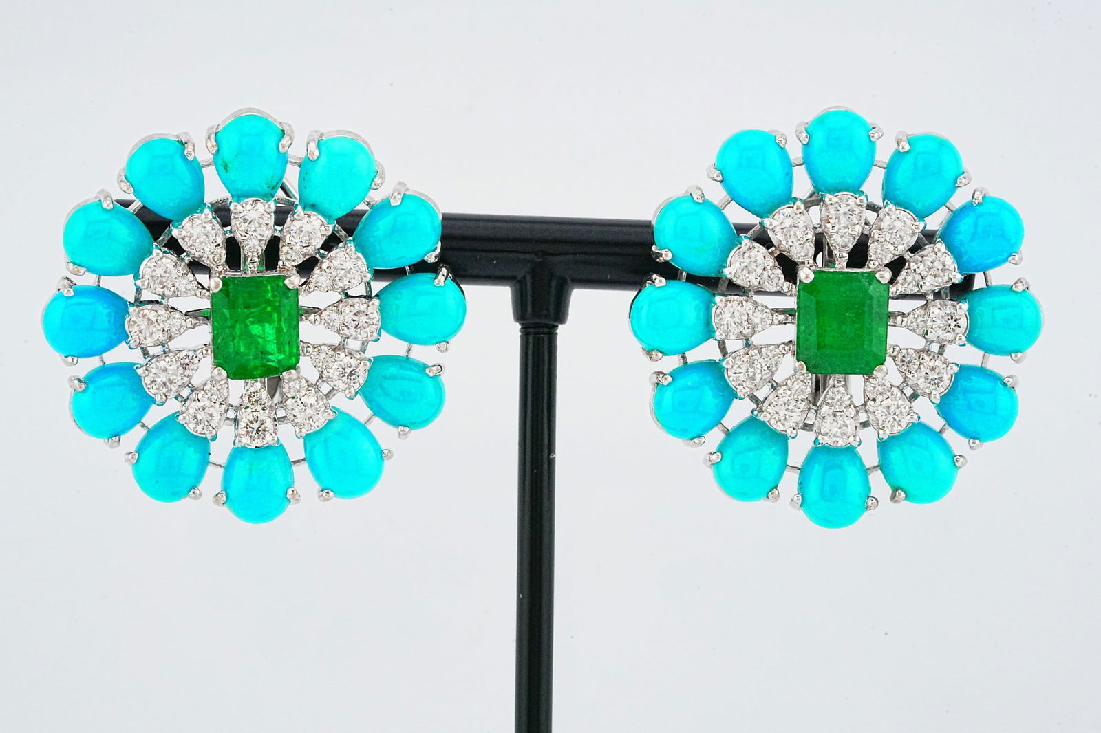 15.40ctw Turquoise, 2.70ctw Emerald, Diamond, 18K Earrings: 15.40ctw Turquoise, 2.70ctw Emerald, 1.65ctw VS2-SI1/G-H Diamond and 18K White Gold 1.10" Earrings - This item will come with a $23,000 insurance valuation report in the winning bidder's name. A beaut