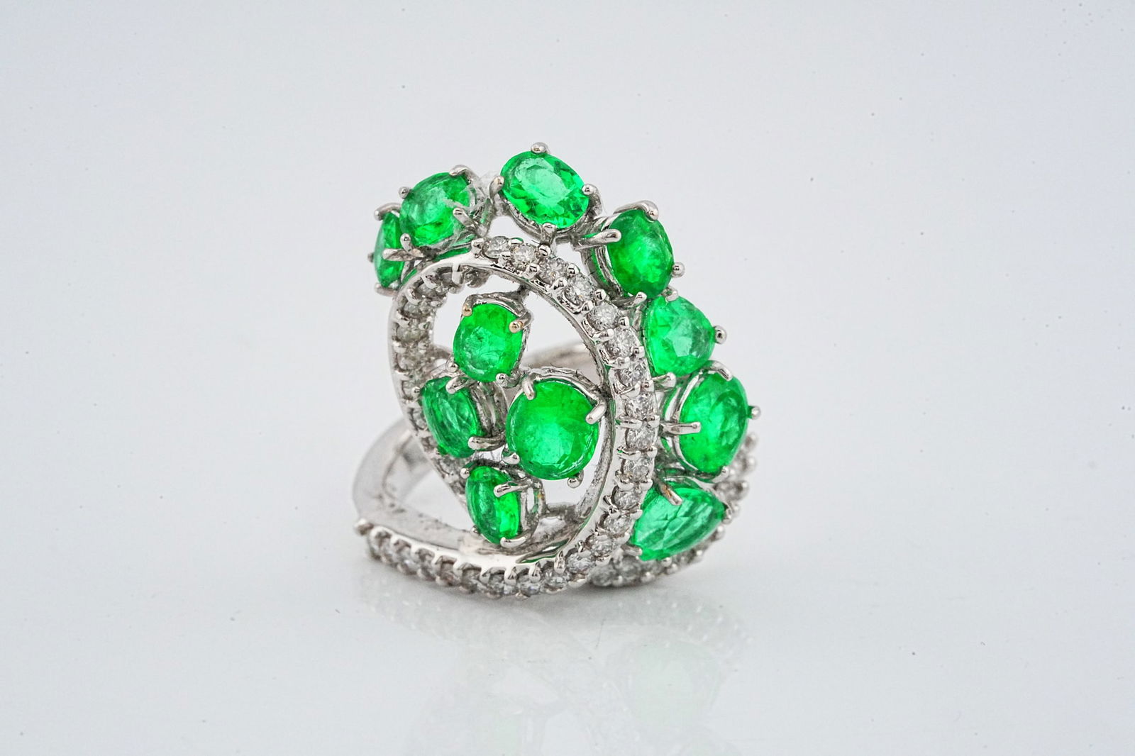 3.00ctw Emerald, 0.85ctw Diamond and 18K Ring: 3.00ctw Emerald, 0.85ctw VS2-SI1/G-H Diamond and 18K White Gold Ring - This item will come with a $14,000 insurance valuation report in the winning bidder's name. A stunning ring showcasing approximat