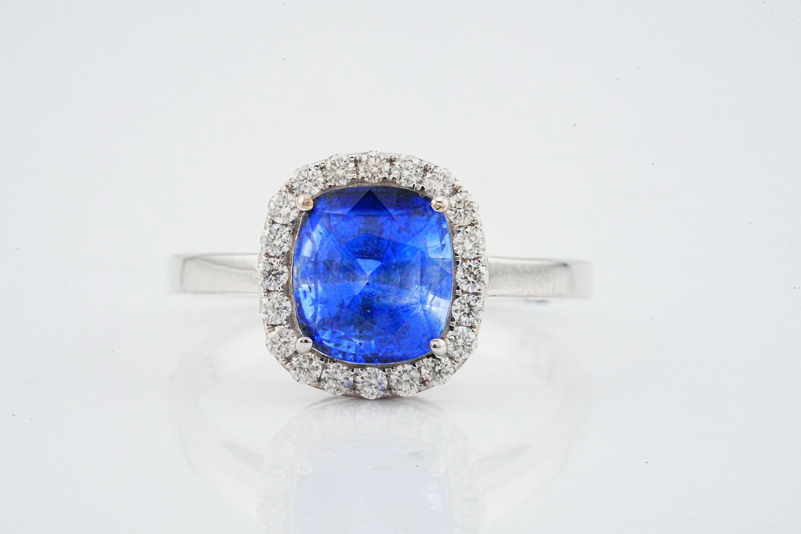 3.05ct Blue Sapphire, 0.40ctw Diamond and 18K Ring: 3.05ct Blue Sapphire, 0.40ctw Diamond and 18K White Gold Ring - This item will come with an $11,500 insurance valuation report in the winning bidder's name. A captivating ring centered by an approxima