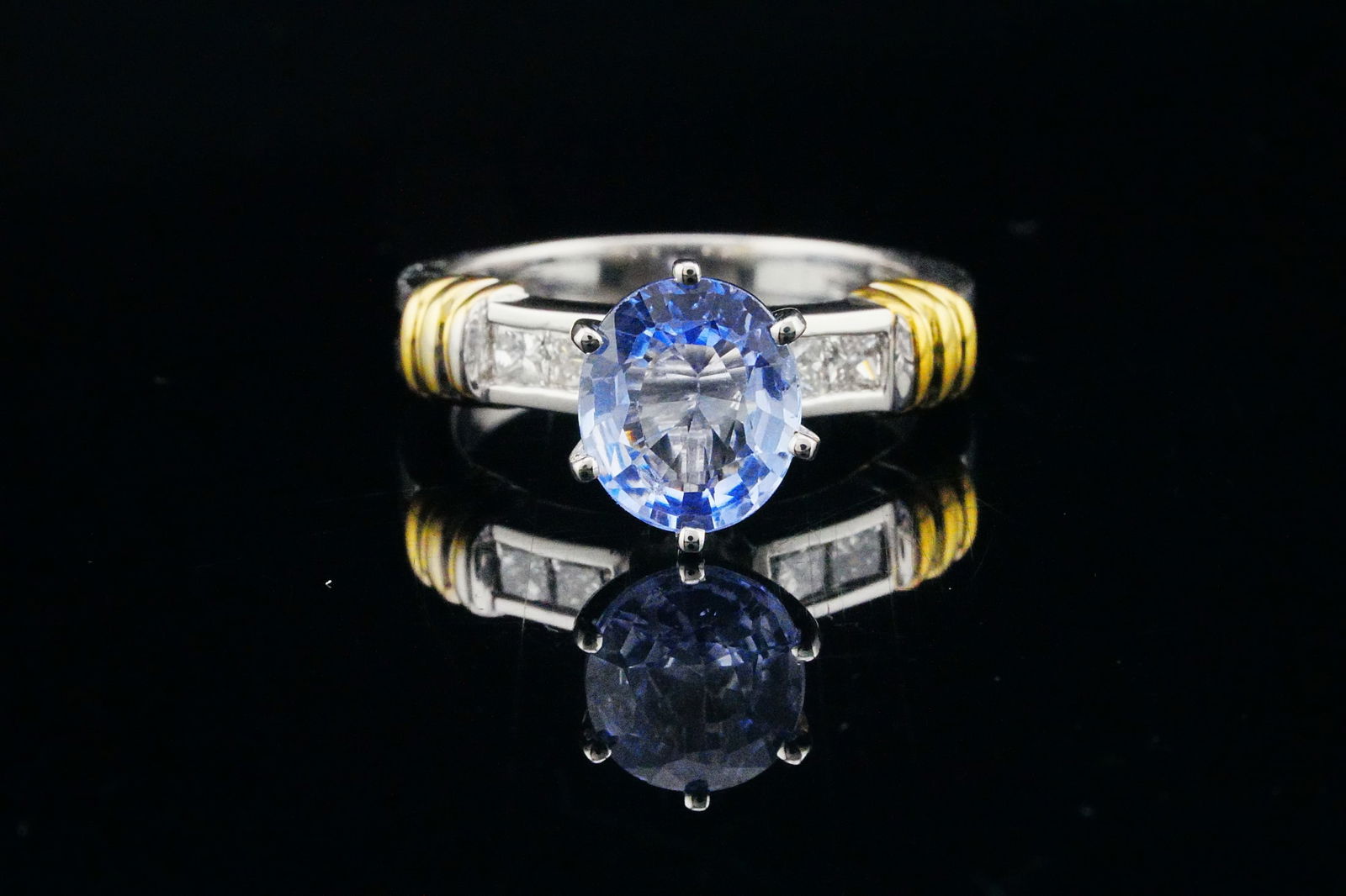 2.90ct GIA Ceylon Sapphire, Diamond, Platinum/18K Ring: 2.90ct GIA Certified Ceylon Sapphire, 0.40ctw Diamond and Platinum/18K Yellow Gold Ring - THIS ITEM WILL COME WITH A $18,000 INSURANCE VALUATION REPORT IN THE WINNING BIDDER'S NAME. A distinguished an