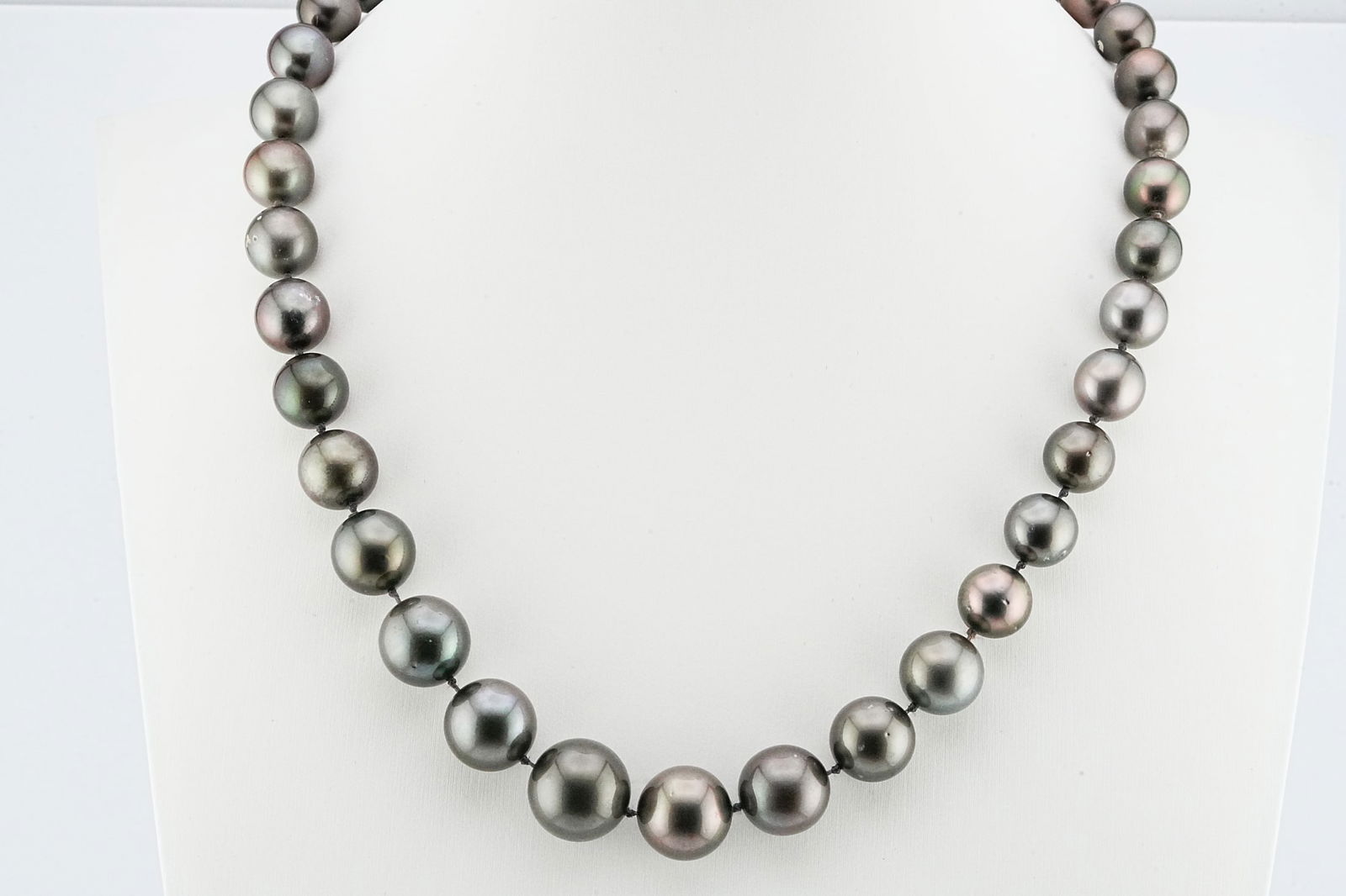 9mm-15mm Tahitian Pearl Necklace W/14K Diamond Clasp: 9mm-15mm Tahitian Pearl 18" Necklace W/14K White Gold Diamond Accented Clasp - THIS ITEM WILL COME WITH A $9,000 INSURANCE VALUATION REPORT IN THE WINNING BIDDER'S NAME. An opulent strand of natural-c