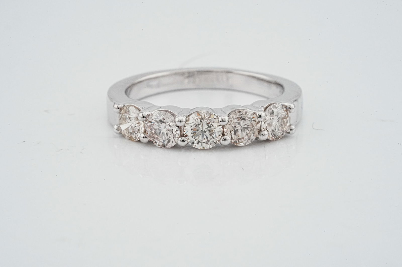 1.00ctw VS1-VS2/G-H Diamond and Platinum 5-Stone Band: 1.00ctw VS1-VS2/G-H Diamond and Platinum 5-Stone Band - THIS ITEM WILL COME WITH A $4,500 INSURANCE VALUATION REPORT IN THE WINNING BIDDER'S NAME. A classic and elegantly tailored platinum five-stone