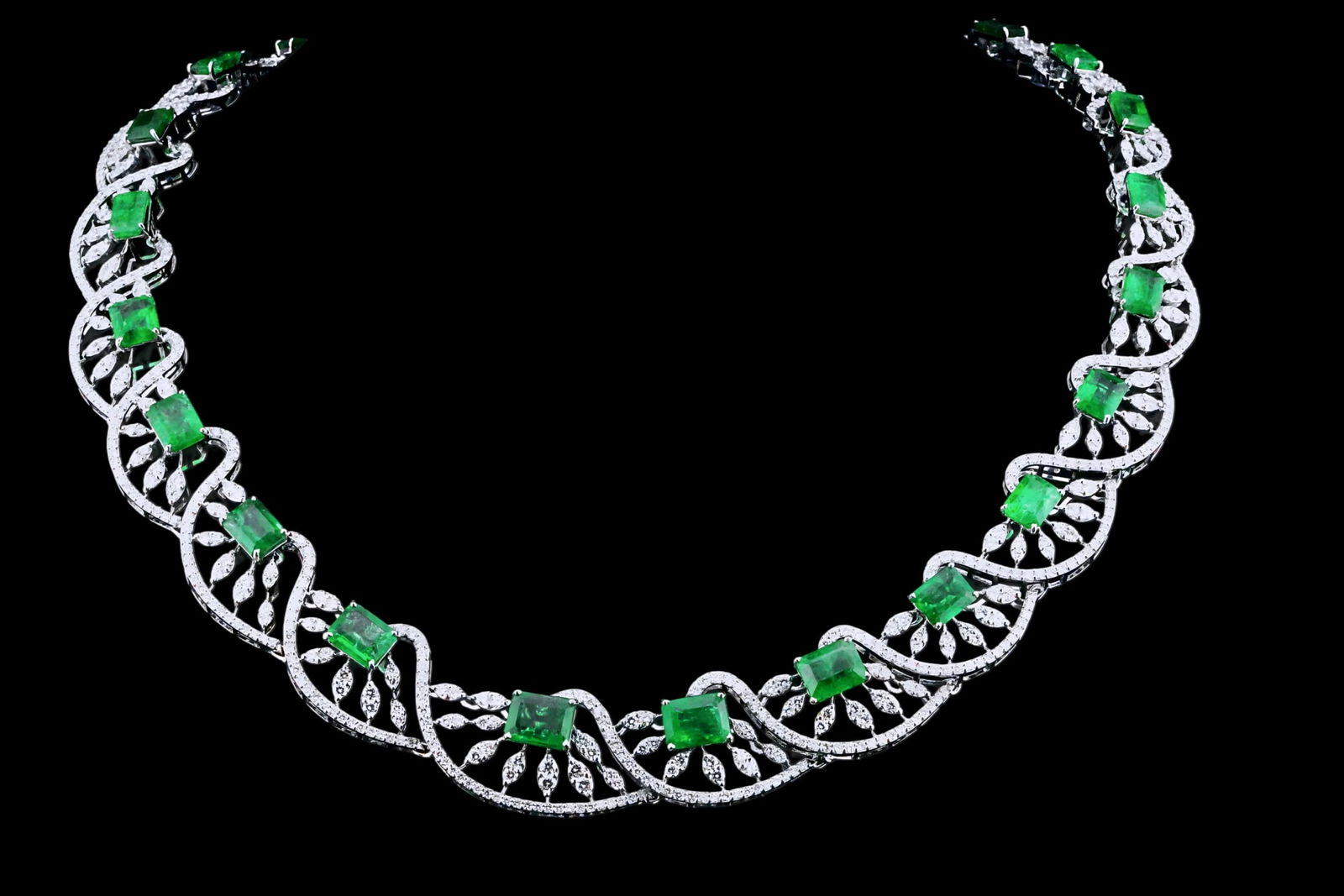 30.75ctw Emerald, 11.50ctw Diamond and 18K Necklace: 30.75ctw Emerald, 11.50ctw VS1-SI1/G-J Diamond and 18K White Gold 16" Cocktail Necklace - THIS ITEM WILL COME WITH A $149,000 INSURANCE VALUATION REPORT IN THE WINNING BIDDER'S NAME. This impressive c