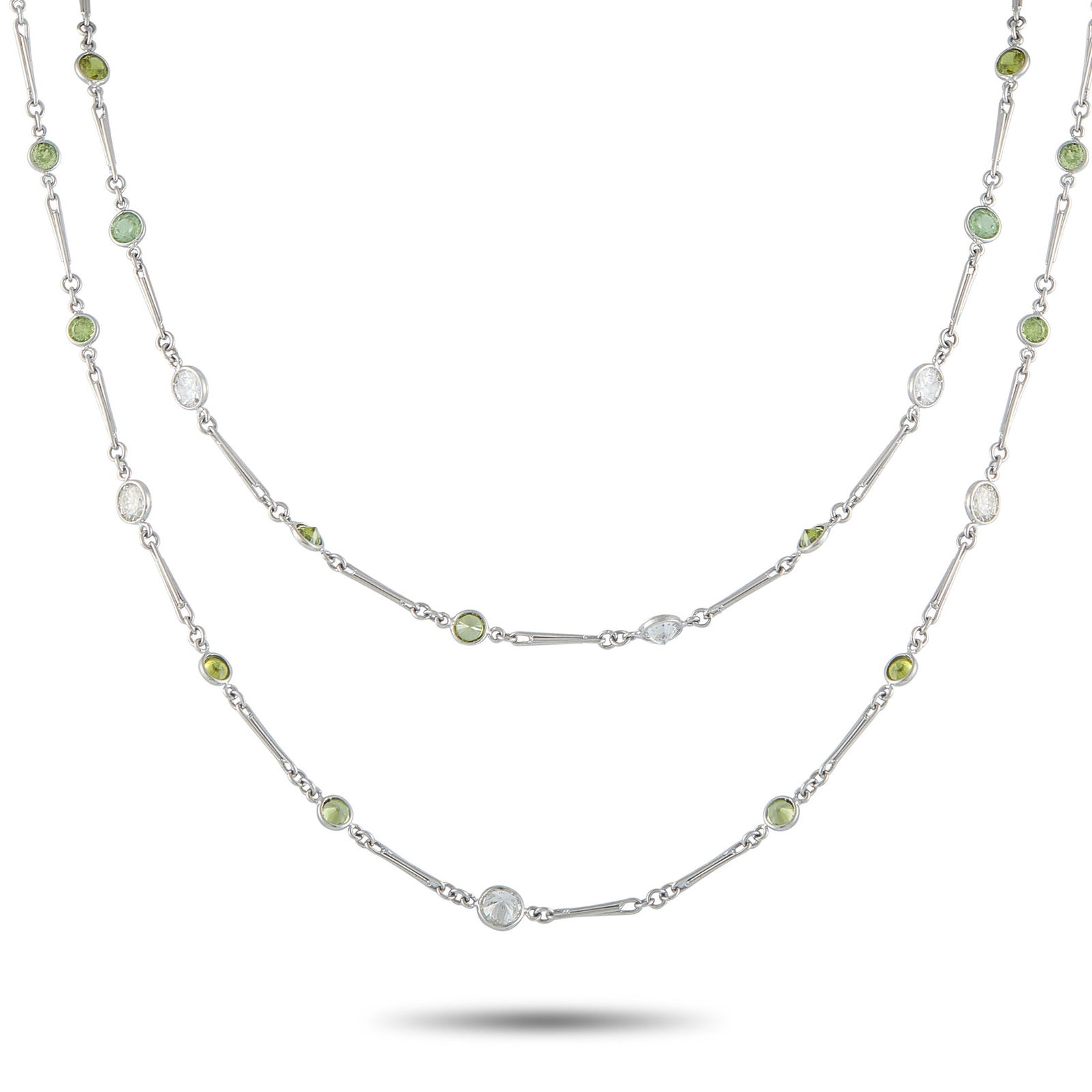 22.90ctw Demantoid, 7.10ctw Diamond, Platinum Necklace: 22.90ctw Demantoid Garnet, 7.10ctw VS1-SI1/G-H Diamond and Platinum 48" Sautoir Necklace - THIS ITEM WILL COME WITH A $42,000 INSURANCE VALUATION REPORT IN THE WINNING BIDDER'S NAME. Graceful and refi