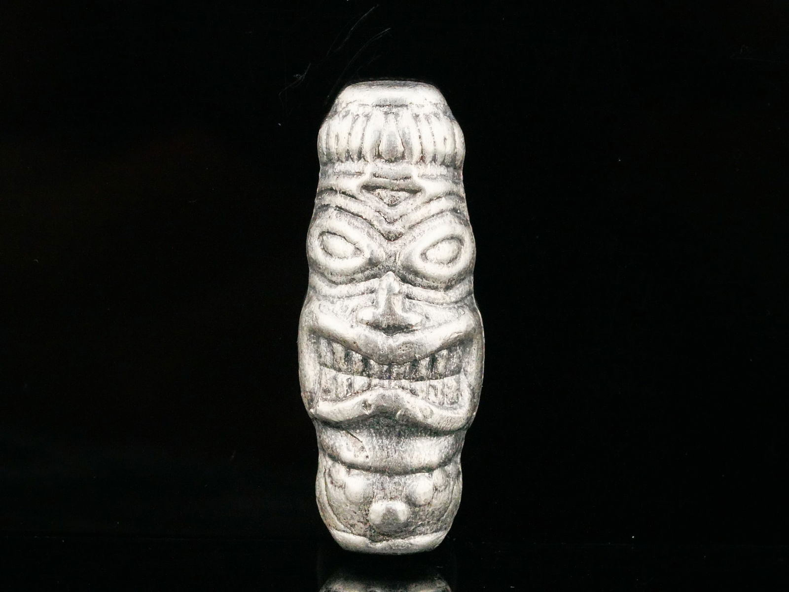 1.46 Troy Ounce .999 Fine Silver Tiki Totem Ingot: 1.46 Troy Ounce .999 Fine Silver Hand Poured Tiki Totem Ingot - Charming hand poured .999 fine silver art ingot sculpted in a stylized tiki totem form, featuring expressive carved facial details and a
