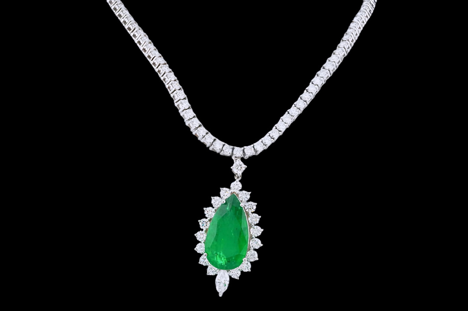 14.85ct Zambian Emerald, 13.25ctw Diamond 14K Necklace: 14.85ct Zambian Emerald, 13.25ctw VS1-SI1/F-H Diamond and 14K White Gold 18" Necklace - This item will come with a $166,000 insurance valuation report in the winning bidder's name by a graduate apprai