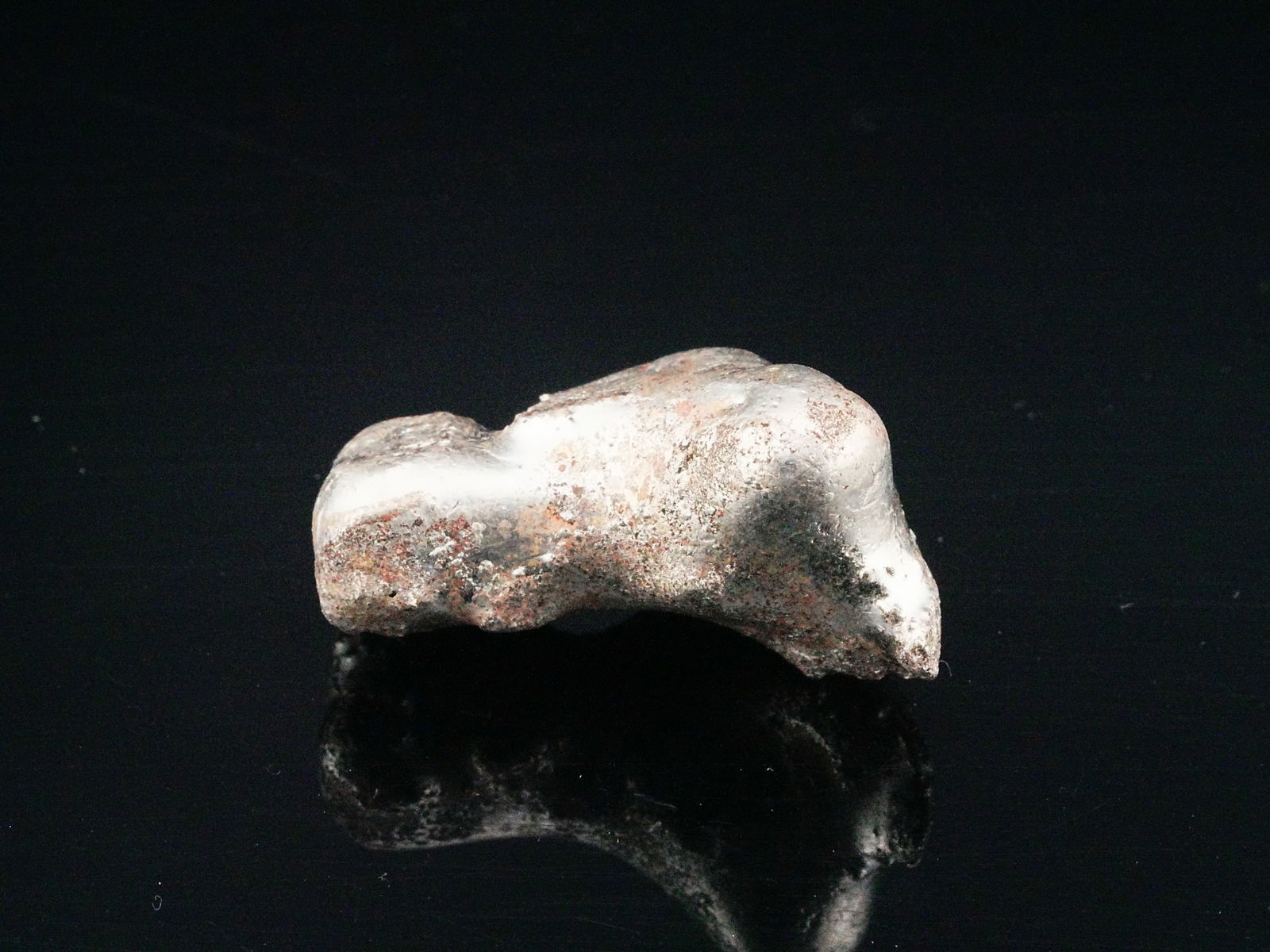 30 Gram .999 Fine Silver Hand Poured Nugget: 30 Gram .999 Fine Silver Hand Poured Nugget - Solid hand poured silver nugget crafted in .999 fine silver, weighing 30 grams (0.96 troy ounces). This organically formed piece exhibits the natural cont