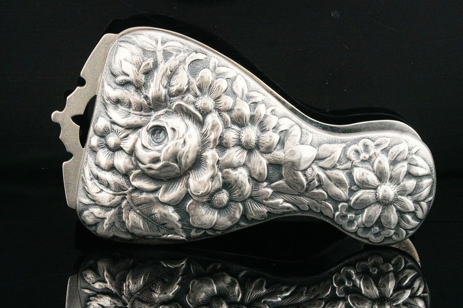 Vintage Sterling Silver Repousse Napkin/Tablecloth Clip: Vintage Sterling Silver Floral Repousse Table Napkin/Tablecloth Clip - An elegant vintage solid sterling silver table clip featuring richly detailed repousse floral decoration across the domed top. Th