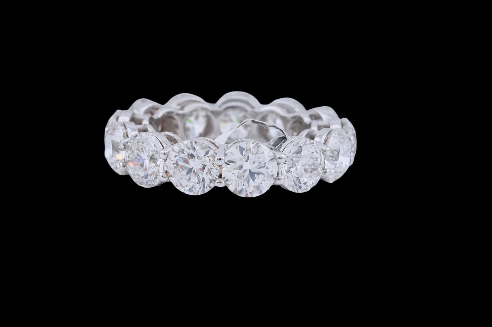 9.27ctw Round Cut Diamond and 18K Eternity Band: 9.27ctw VS1-SI1/G-H Round Cut Diamond and 18K White Gold Eternity Band - This item will come with a $118,500 insurance valuation report in the winning bidder's name by a graduate appraiser. A bold
