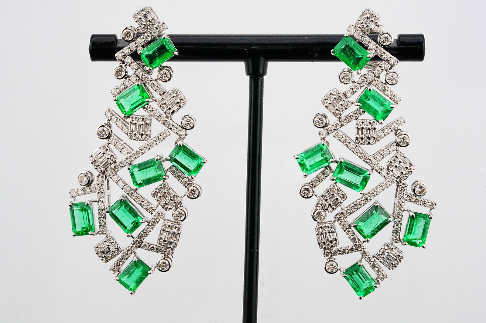 8.20ctw Emerald, 3.00ctw Diamond and 18K Earrings: 8.20ctw Emerald, 3.00ctw VS1-VS2/G-H Diamond and 18K White Gold 2.10" Earrings - This item will come with a $32,500 insurance valuation report in the winning bidder's name. An exceptional high