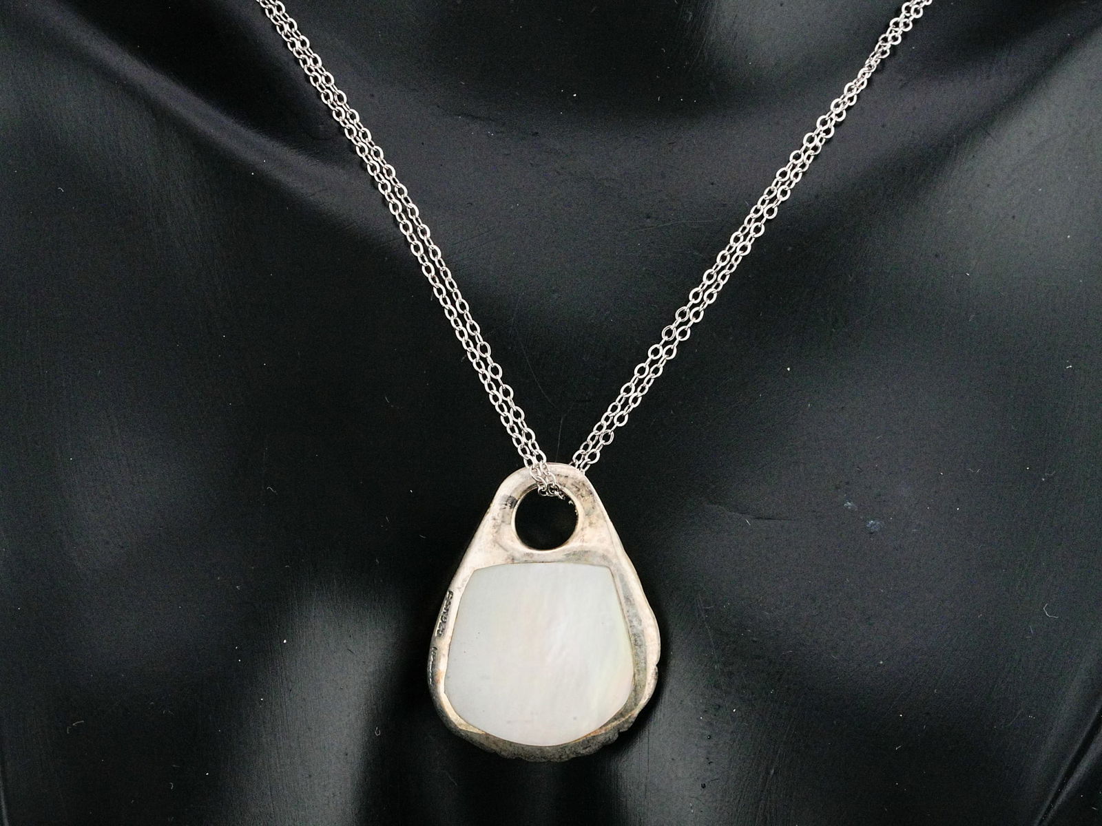 Sterling Silver and Mother of Pearl 18" Necklace: Sterling Silver and Mother of Pearl 18" Pendant Necklace - This necklace is crafted in sterling silver and showcases a 1" pendant with inlaid mother of pearl, hanging from a dual strand chain.