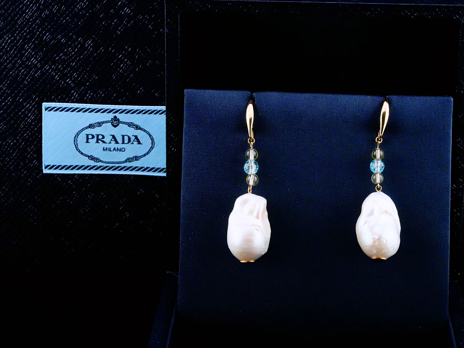 Prada 23mm Baroque Pearl, Gemstone Bead and 18K Earrings: Prada 23mm Baroque Pearl, Gemstone Bead and 18K Yellow Gold 2.5" Drop Earrings W/Pouch and Box - These striking Prada drop earrings are crafted in luxurious 18K yellow gold and showcase an elegant int