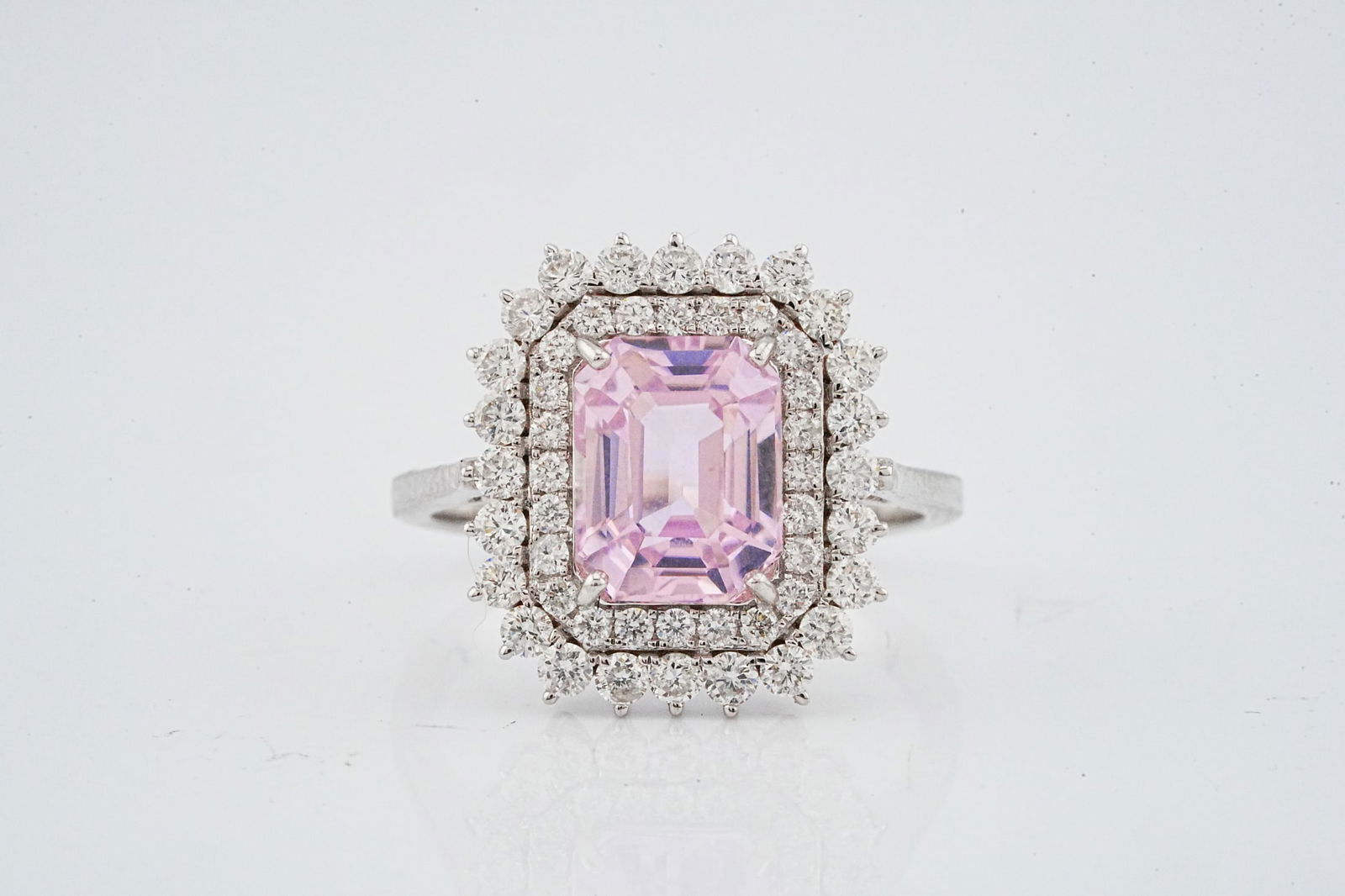 2.85ct Kunzite, 0.85ctw Diamond and 18K Ring: 2.85ct Kunzite, 0.85ctw VS2-SI1/G-H Diamond and 18K White Gold Ring - This item will come with a $7,000 insurance valuation report in the winning bidder's name. An elegant ring centered by an approxim