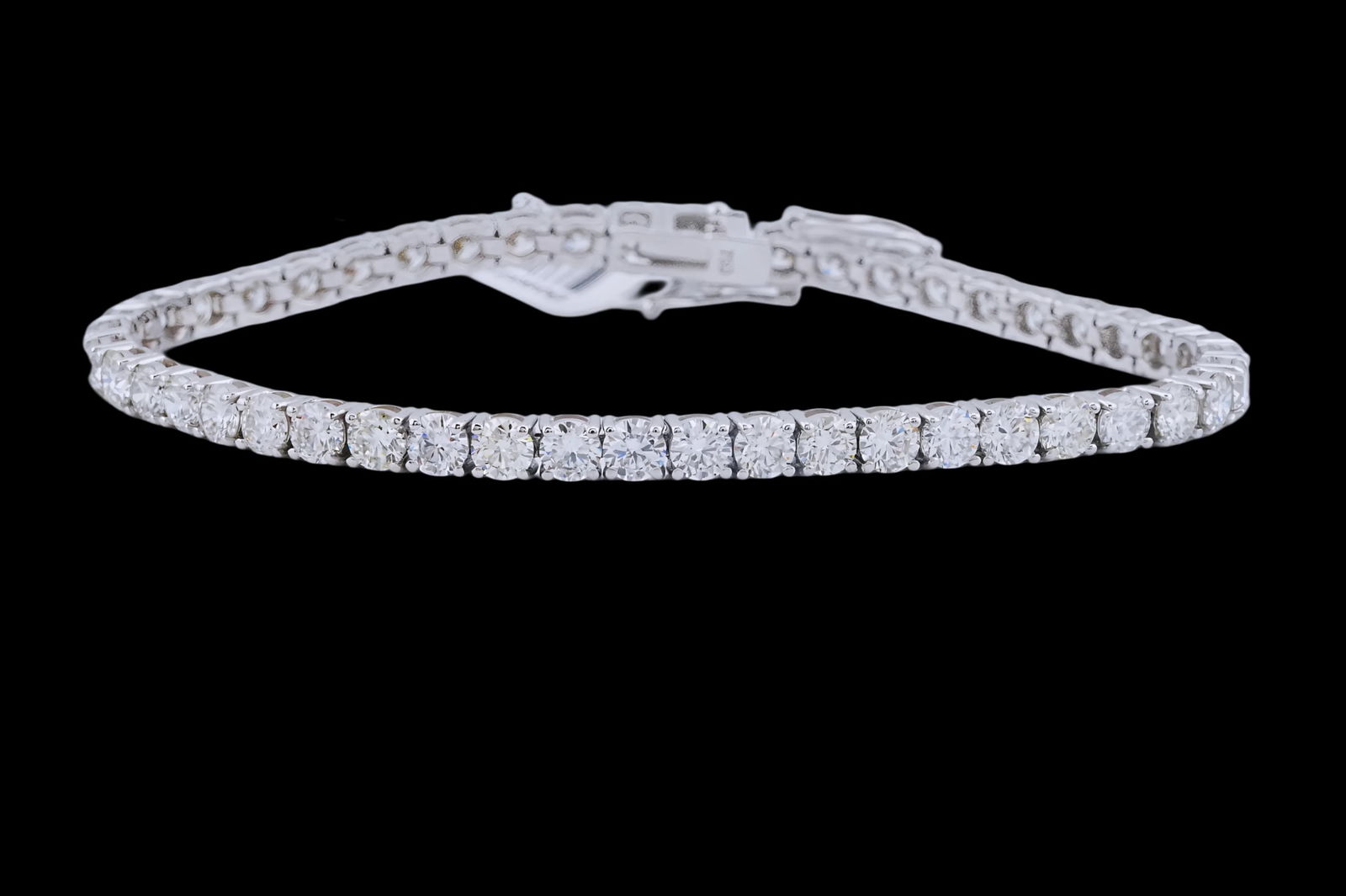 9.00ctw Diamond and 18K 7.25" Tennis Bracelet: 9.00ctw VS1-SI1/F-H Brilliant Round Cut Diamond and 18K White Gold 7.25" Tennis Bracelet - This item will come with a $46,500 insurance valuation report in the winning bidder's name by a graduate appr