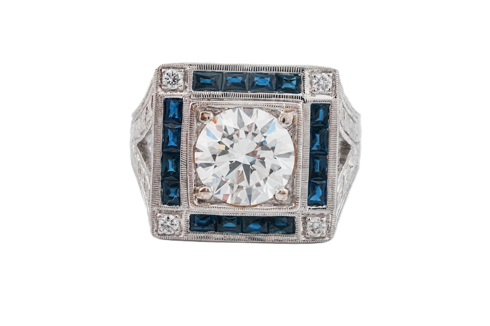 1.40ct Lab Grown Diamond, Blue Sapphire and 18K Ring: 1.40ct Lab Grown Diamond, Blue Sapphire and 18K White Gold Ring W/0.10ctw Accent Diamonds - This item will come with a $7500 insurance valuation report in the winning bidder's name by a graduate appra