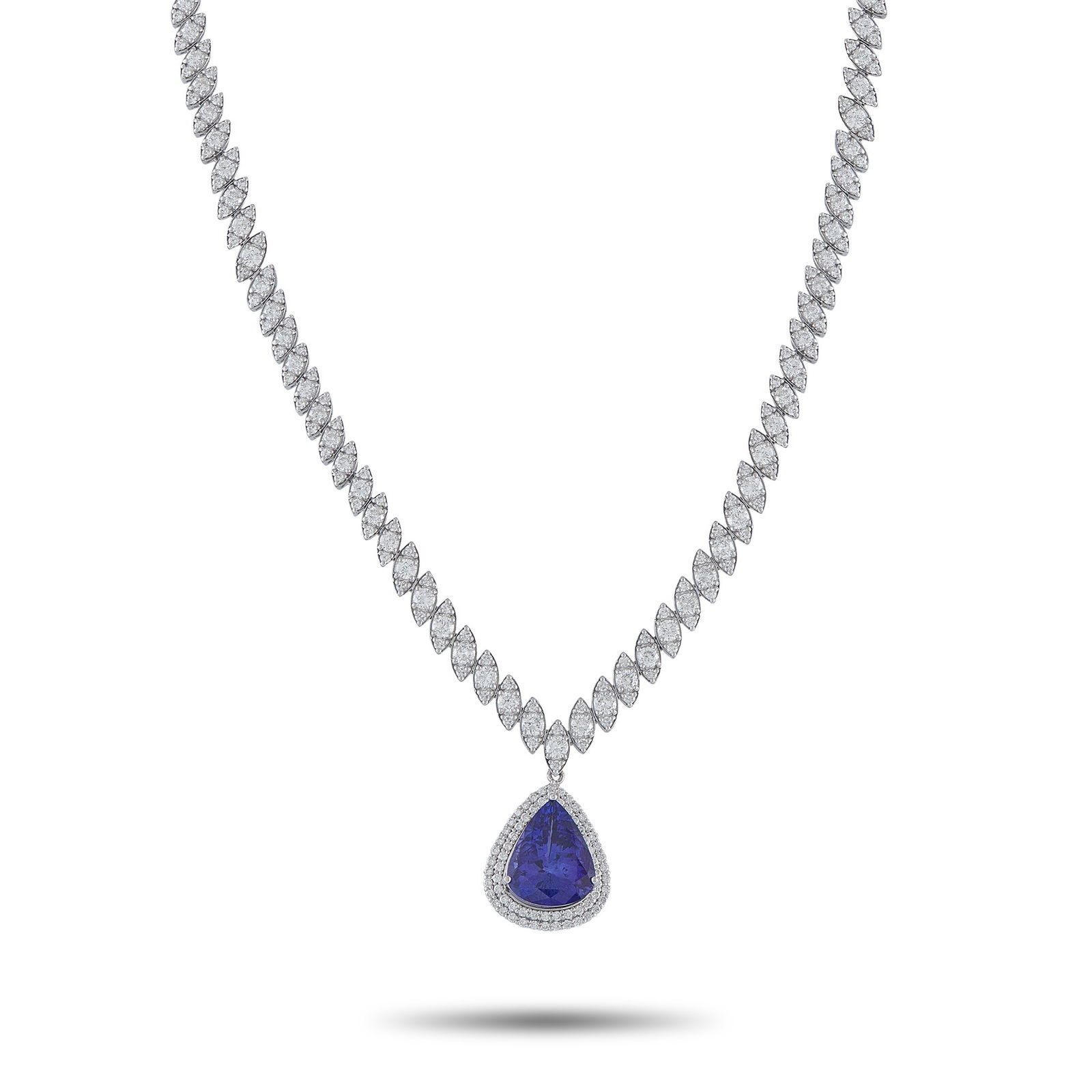 11.75ct Tanzanite, 10.00ctw Diamond and 18K Necklace: 11.75ct Tanzanite, 10.00ctw VS2-SI1/G-H Diamond and 18K White Gold 16" Necklace - THIS ITEM WILL COME WITH A $35,000 INSURANCE VALUATION REPORT IN THE WINNING BIDDER'S NAME. Striking and undeniably el
