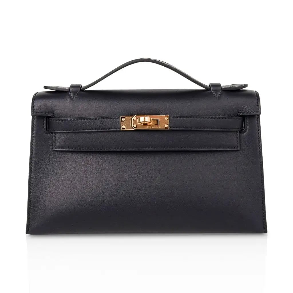 Hermes Black Swift Leather Kelly Pochette GHW: Hermes Black Swift Leather Kelly Pochette W/Gold Hardware (Includes Box and Sleeper) - The Hermes Kelly Pochette in Black Swift leather embodies understated sophistication through clean proportion