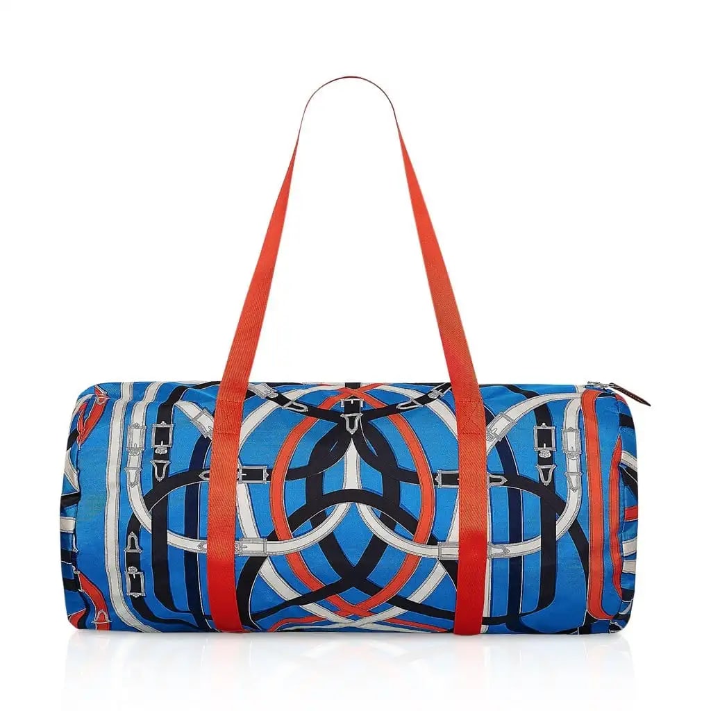 Hermes Rare Airsilk Cavalcadour 50 Blue Silk Duffle Bag: Hermes Rare Airsilk Cavalcadour 50 Blue Silk Duffle Bag - This Hermes Airsilk Duffle Cavalcadour 50 in Blue is a limited-edition blend of luxury and practicality. Made from waterproof-treated silk, it