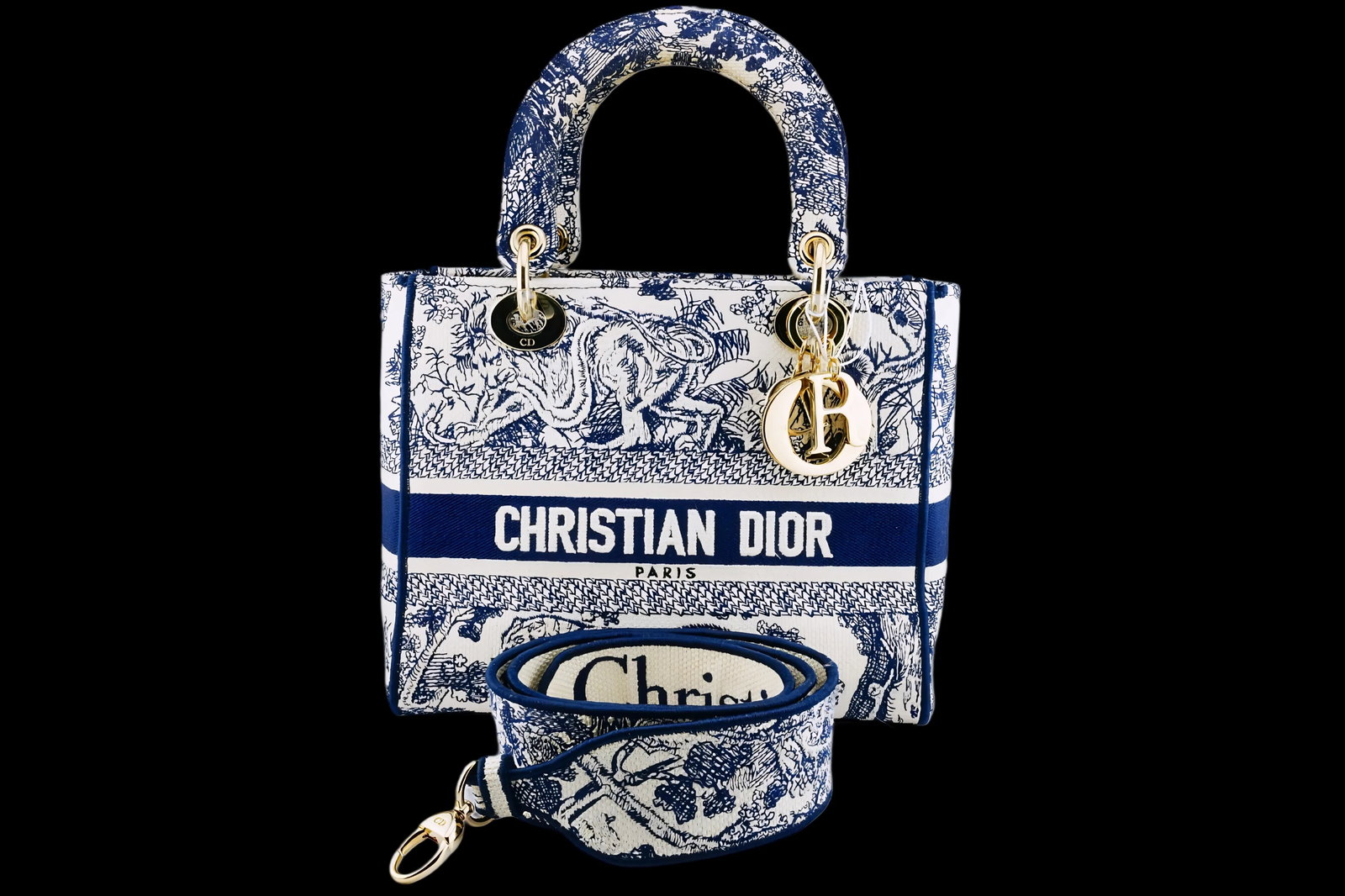 Dior Ecru and Blue Toile de Jouy Medium Lady D-Lite Bag: Dior Ecru and Blue Toile de Jouy Embroidery Medium Lady D-Lite Bag - An elegant fusion of heritage design and modern craftsmanship, this Dior Medium Lady D-Lite bag is rendered in the house's iconic T