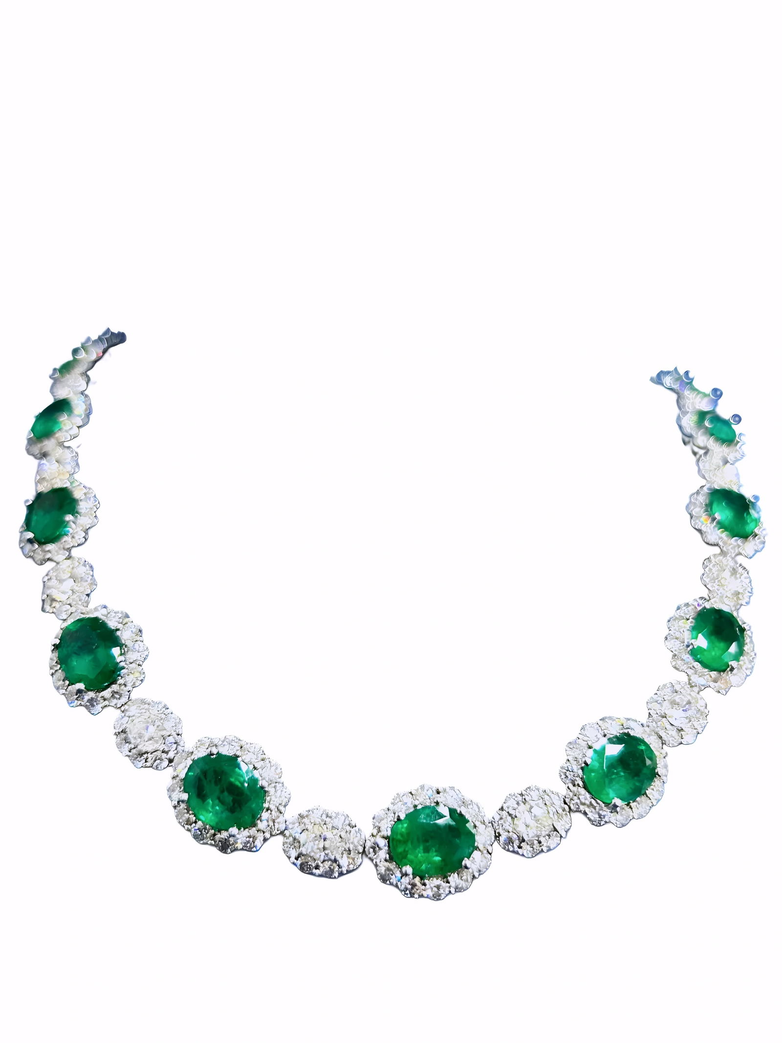 37.00ctw Emerald, 23.65ctw Diamond and 18K Necklace: 37.00ctw Emerald, 23.65ctw Diamond and 18K White Gold 18" Cocktail Necklace - THIS ITEM WILL COME WITH A $135,000 INSURANCE VALUATION REPORT. An opulent and visually captivating statement piece, this