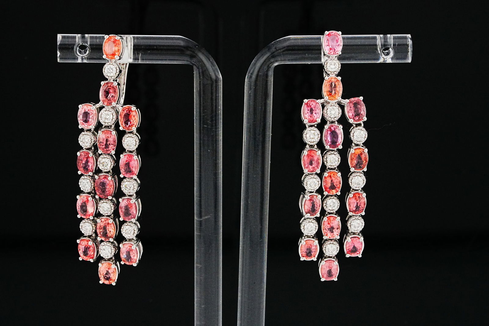 6.70ctw Sapphire, 0.65ctw Diamond and Platinum Earrings: 6.70ctw Pink Sapphire, 0.65ctw Diamond and Platinum Chandelier Earrings - THIS ITEM WILL COME WITH A $22,000 INSURANCE VALUATION REPORT. Elegant and vibrant, these striking chandelier earrings