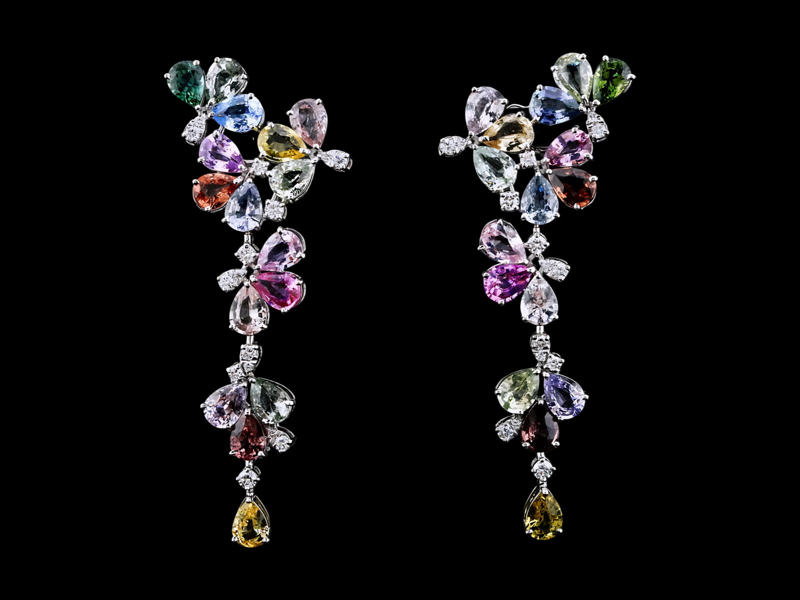 32.50ctw Sapphire, 1.00ctw Diamond and 18K Earrings: 32.50ctw Multi-Color Sapphire, 1.00ctw VS1-SI1/G-H Diamond and 18K White Gold 2.75" Drop Earrings - THIS ITEM WILL COME WITH A $40,000 INSURANCE VALUATION REPORT. These beautifully designed drop earri