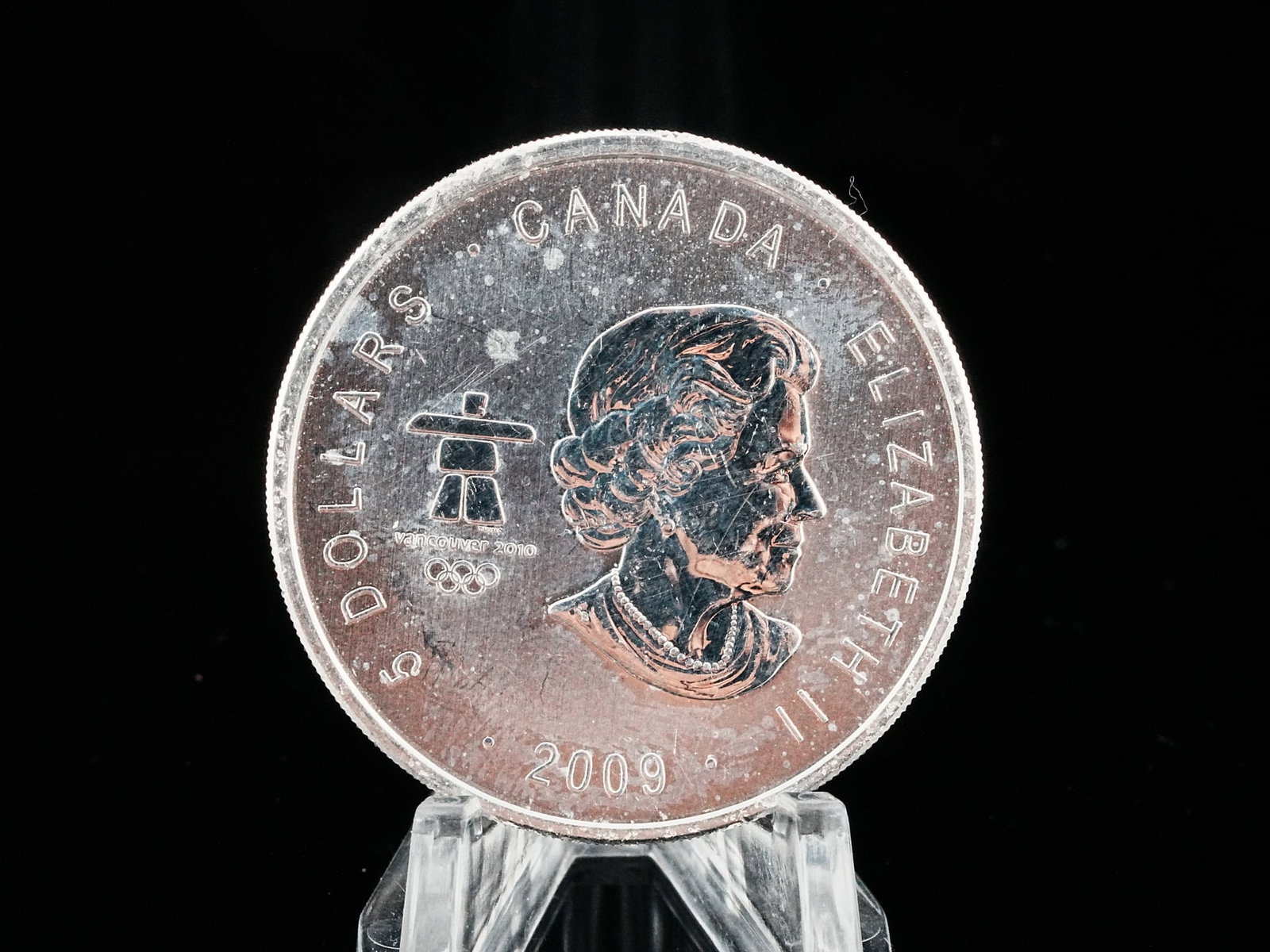 2009 Canada 1 Oz .9999 Silver Vancouver Olympics Coin: 2009 Canada 1 Troy Ounce .9999 Fine Silver $5 Vancouver Olympics Thunderbird Coin - A striking commemorative issue celebrating the 2010 Vancouver Winter Olympic Games, this 2009 Canadian $5 silver