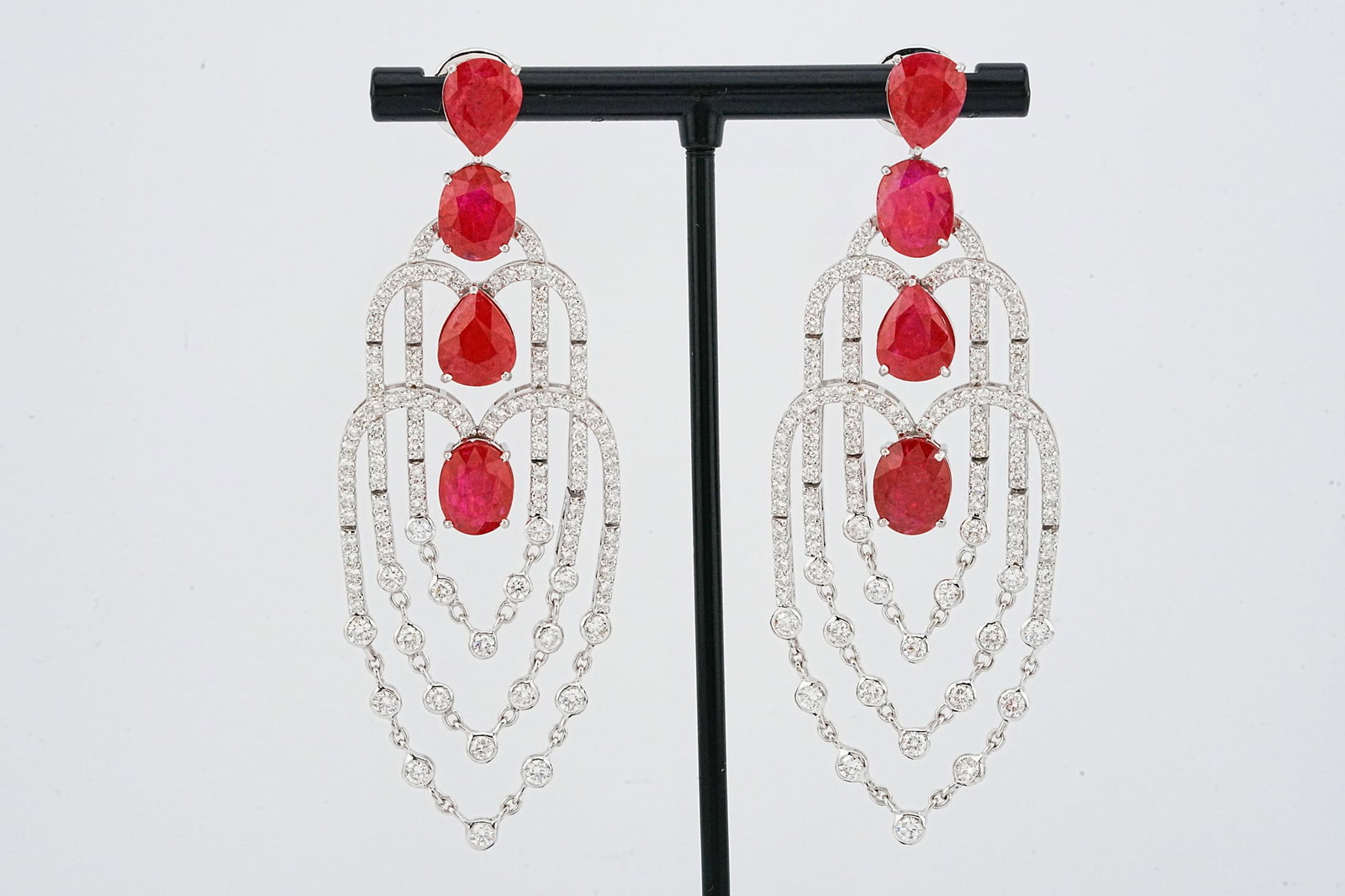 18.20ctw Ruby, 4.30ctw Diamond and 18K 3" Earrings: 18.20ctw Ruby, 4.30ctw VS1-VS2/G-H Diamond and 18K White Gold 3" Chandelier Earrings - This item will come with a $43,000 insurance valuation report. Showcasing approximately 18.20 carats total