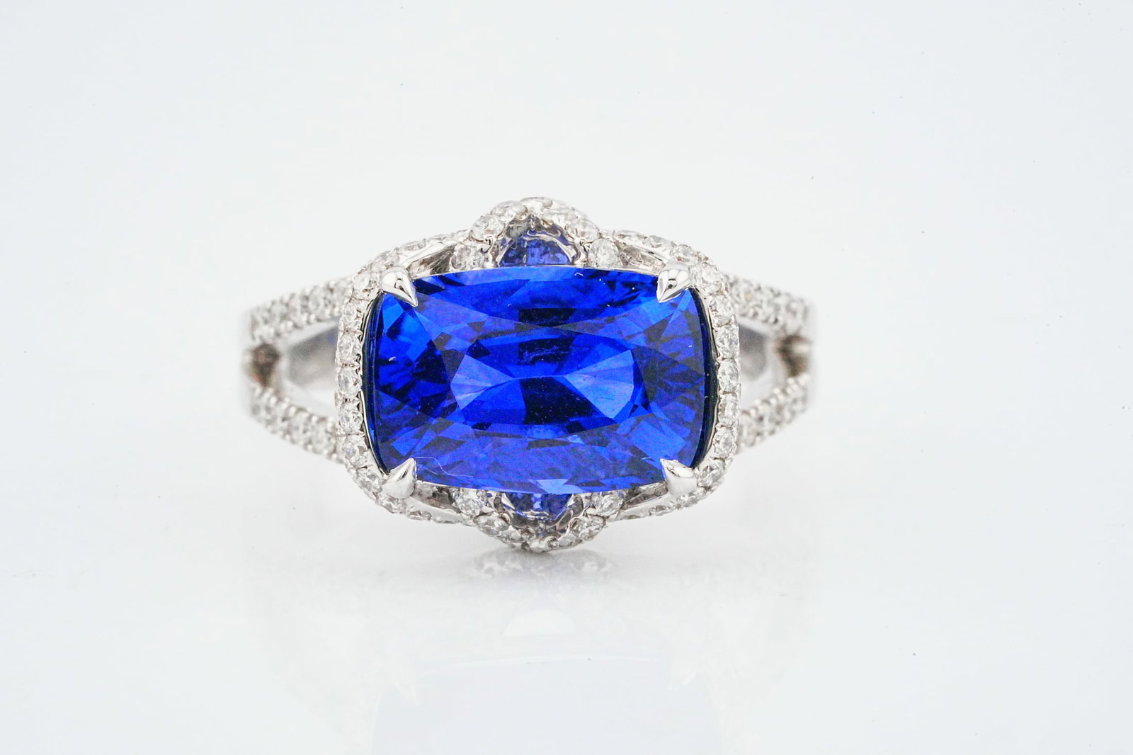 5.50ct Blue Sapphire, 0.85ctw Diamond and 18K Ring: 5.50ct Blue Sapphire, 0.85ctw Diamond and 18K White Gold Ring - This item will come with a $39,000 insurance valuation. A stunning ring centered by a captivating approximately 5.50 carat blue sapphire