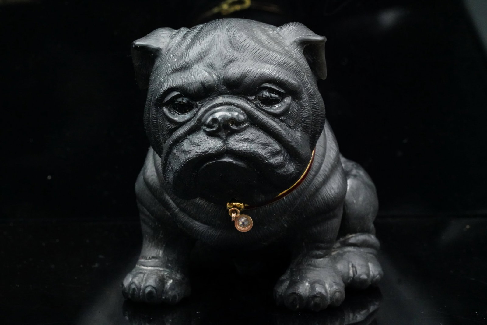 Carved Obsidian Bulldog Statuette, Diamond Accent: Carved Obsidian Bulldog Statuette w/ Red Enamel Collar and Diamond Accent - This piece is made of solid obsidian, and is a genuine, museum quality artifact. The piece is a hand-carved depiction of a b