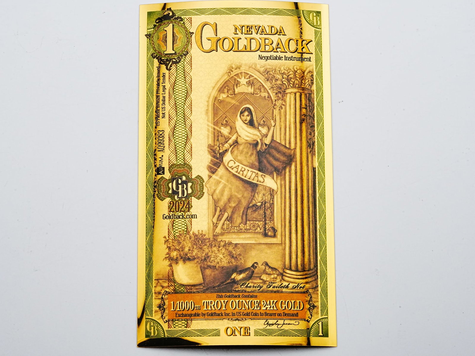 1 Nevada Goldback 1/1000th Troy Ounce 24K Gold: 1 Nevada Goldback 1/1000th Troy Ounce 24K Gold - A beautifully crafted Nevada Goldback note containing 1/1000th troy ounce of 24K gold, combining tangible precious metal value with intricate artistic