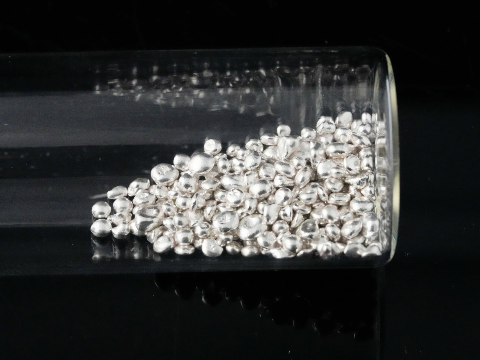 24.5 Grams .999 Silver Pellets: 24.5 Grams .999 Silver Pellets - Offered here is a lot of 24.5 grams of .999 fine silver pellets, neatly housed in a clear glass jar for easy storage and display. These bright, high-purity silver bead