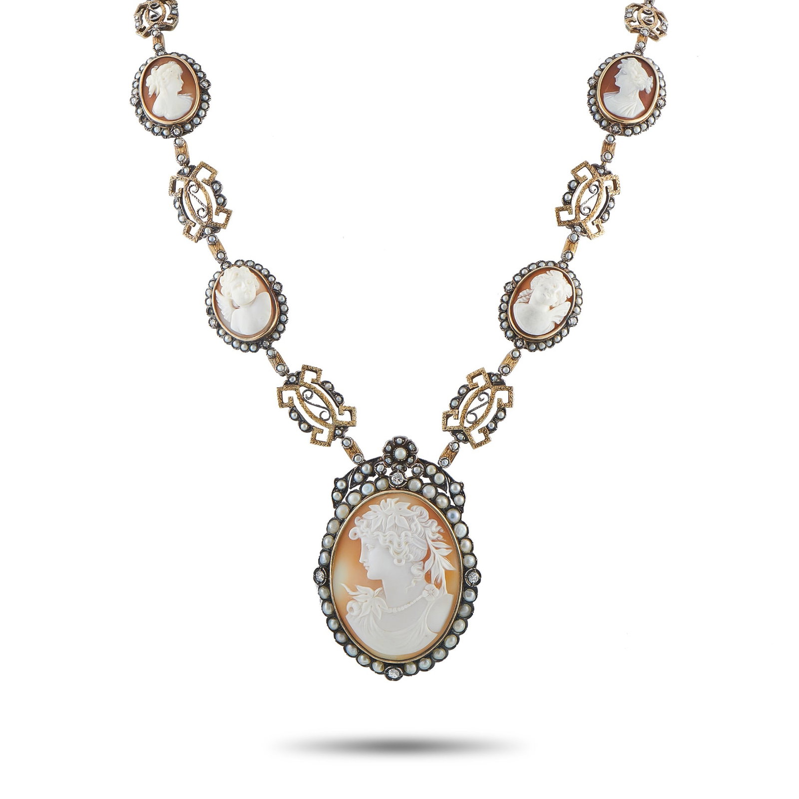 2.00ctw Diamond, Cameo, Pearl and 14K/Silver Necklace: 2.00ctw Diamond, Carved Shell Cameo, Seed Pearl and 14K Yellow Gold/Silver Antique 26" Necklace - Rich in period detail and craftsmanship, this antique cameo necklace embodies timeless elegance. The d