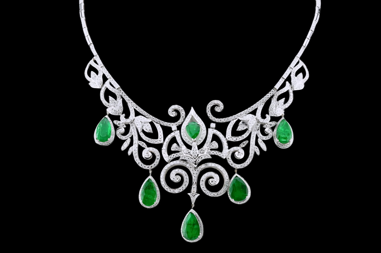 25.35ctw Emerald, 12.80ctw Diamond and 18K Necklace: 25.35ctw Pear-Cut Emerald, 12.80ctw VS1-SI1/G-H Diamond and 18K White Gold 18" Openwork Filigree Cocktail Necklace - THIS ITEM WILL COME WITH A $111,000 INSURANCE VALUATION REPORT. An extraordinary di