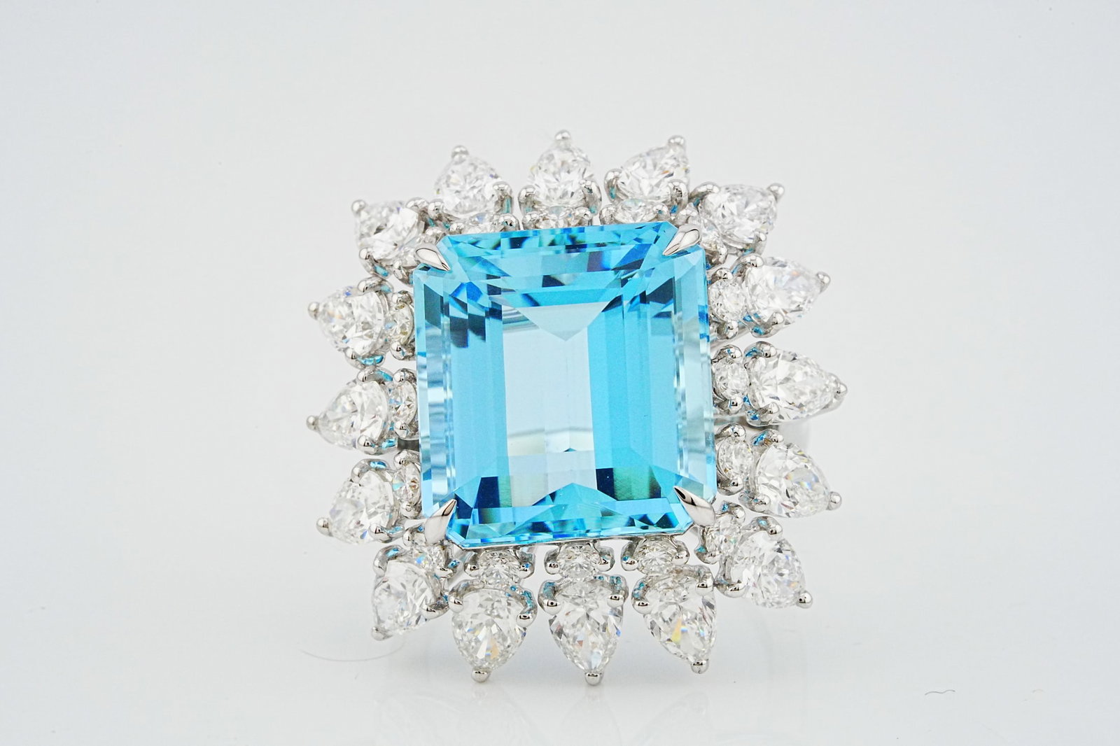 14.50ct Aquamarine, 4.60ctw Diamond and 18K Ring: 14.50ct Aquamarine, 4.60ctw VS1-VS2/G-H Diamond and 18K White Gold Ring - THIS ITEM WILL COME WITH A $55,500 INSURANCE VALUATION REPORT. A breathtaking statement ring, centered around a magnificent em