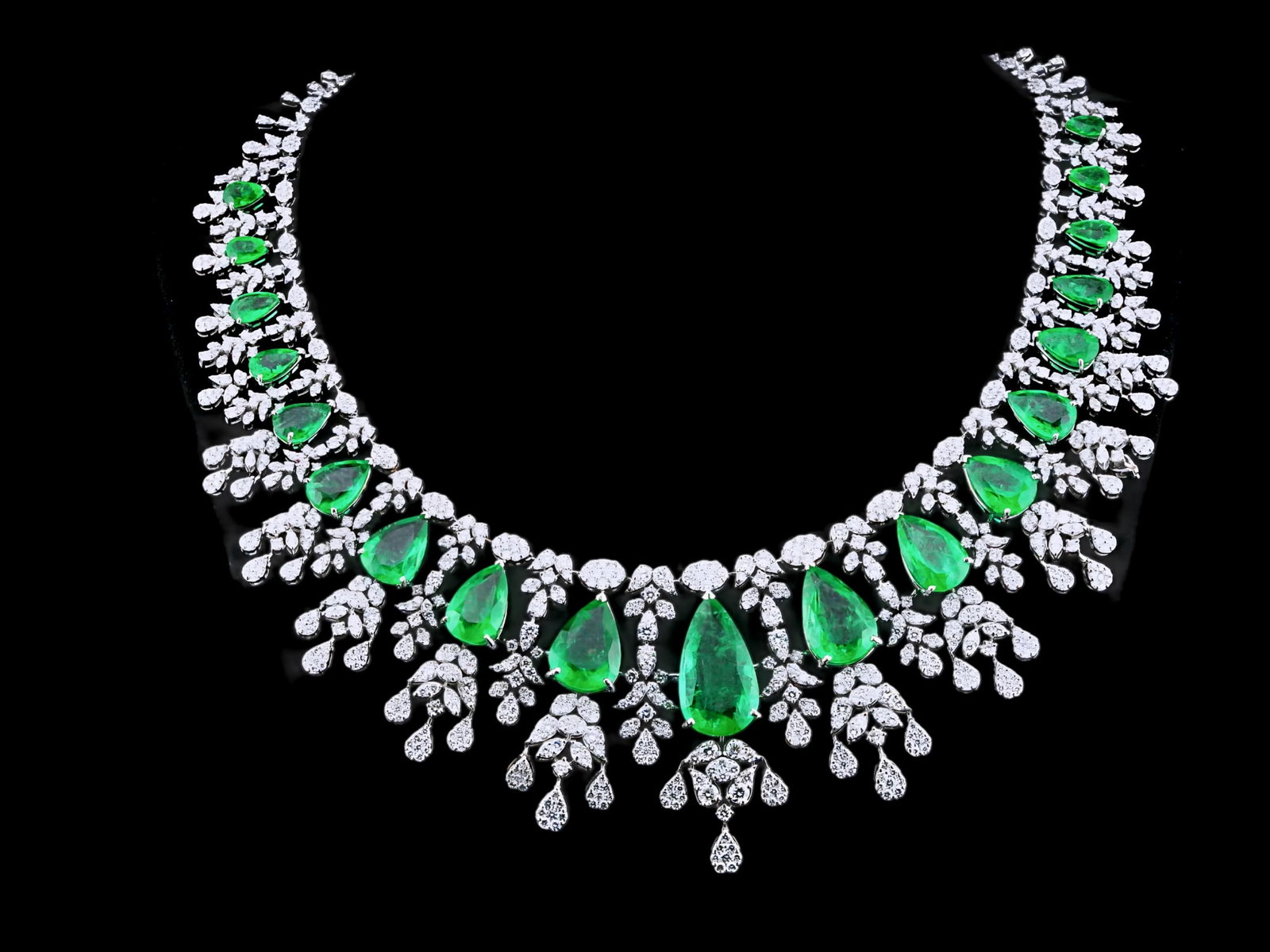 52.60ctw Emerald, 20.00ctw Diamond and 18K Necklace: 52.60ctw Emerald, 20.00ctw VS1-SI1/G-H Diamond and 18K White Gold 16" Cocktail Necklace - THIS ITEM WILL COME WITH A $242,000 INSURANCE VALUATION REPORT. This extraordinary cocktail necklace is master