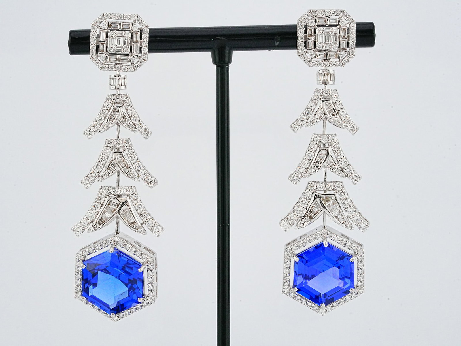 16.00ctw Tanzanite, 2.65ctw Diamond and 18K Earrings: 16.00ctw Tanzanite, 2.65ctw VS1-SI1/G-J Diamond and 18K White Gold 2.25" Dangle Earrings - This item will come with a $44,000 insurance valuation report. Showcasing approximately 16.00 carats total we