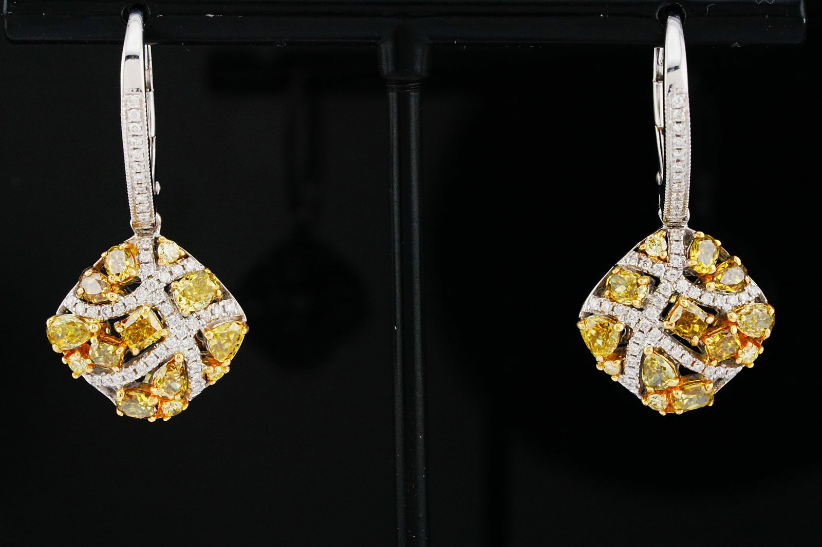 3.20ctw Yellow Diamond, 0.30ctw Diamond and 14K Earrings: 3.20ctw Yellow Diamond, 0.30ctw Diamond and 14K Yellow/White Gold 1.25" Drop Earrings - THIS ITEM WILL COME WITH A $15,500 INSURANCE VALUATION REPORT. A vibrant and elegant pair of drop earrings showc