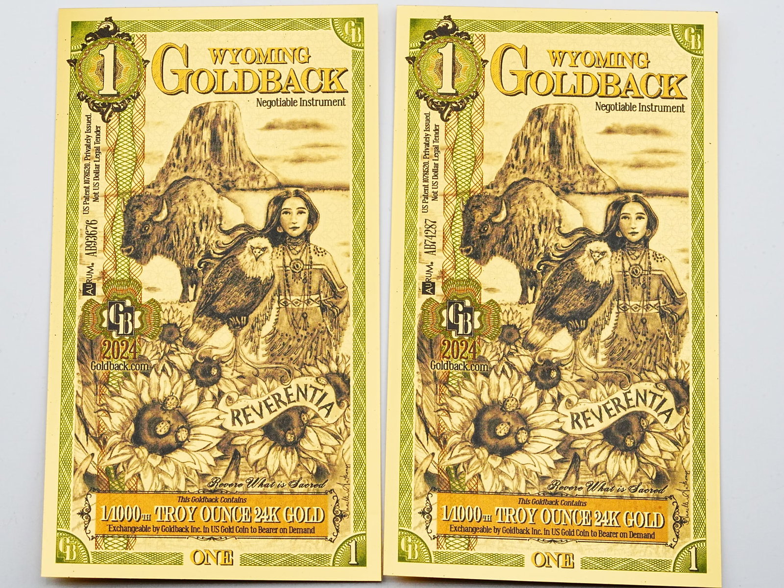 Lot of (2) 1 Wyoming Goldbacks 1/1000th Ounce 24K Gold: Lot of (2) 1 Wyoming Goldbacks 1/1000th Troy Ounce 24K Gold - A collectible lot of two Wyoming Goldbacks, each containing 1/1000th troy ounce of 24K gold embedded within a beautifully designed, spenda