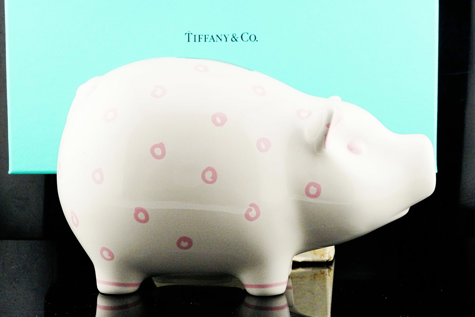 Tiffany & Co. Dot Piggy Bank Never Used W/Box: Tiffany & Co. Dot Piggy Bank Earthenware with Pink Accents Never Used W/Original Box and Shopping Bag - A charming and highly collectible piece from Tiffany & Co., this Dot Piggy Bank is crafted in fi