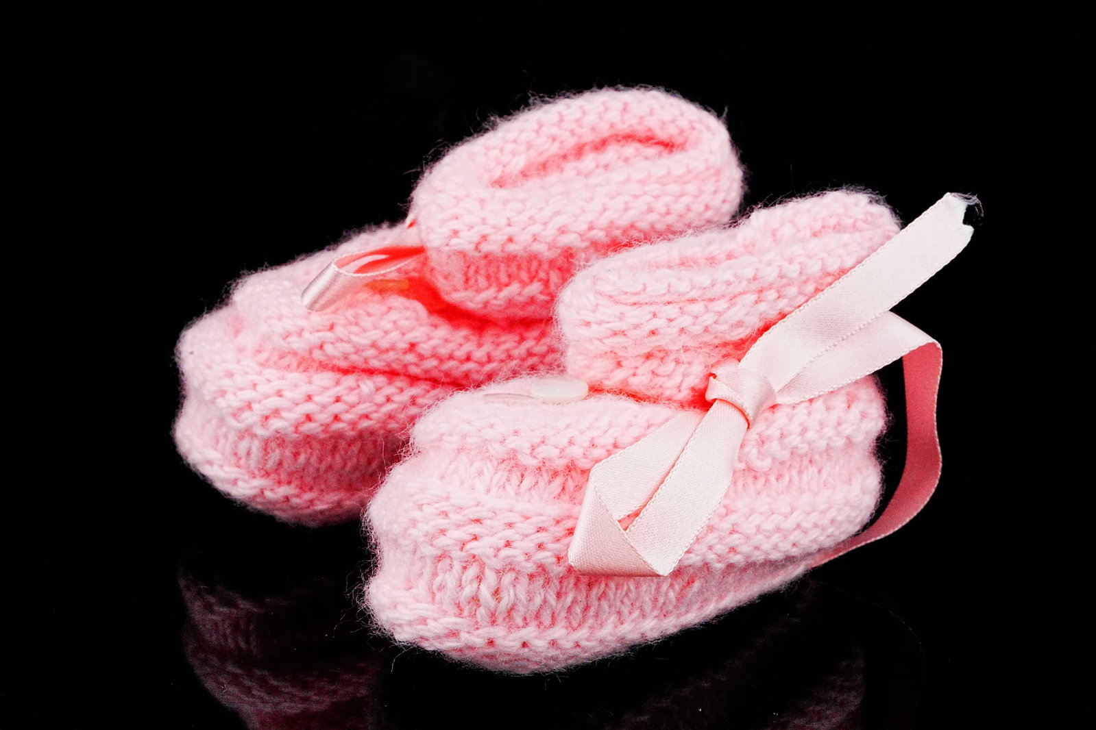 Handmade Pink Knit Baby Booties W/Mother of Pearl Buttons: Vintage Handmade Pink Knit Baby Booties W/Mother of Pearl Buttons - A charming and nostalgic vintage piece, these handmade pink knit baby booties capture the warmth and craftsmanship of traditional ha