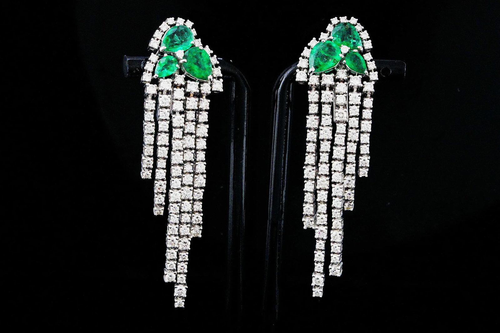 5.65ctw Diamond, 4.40ctw Emerald and 18K 2.5" Earrings: 5.65ctw VS1-SI1/G-H Diamond, 4.40ctw Emerald and 18K White Gold 2.5" Tassel Fringe Earrings - THIS ITEM WILL COME WITH A $41,000 INSURANCE VALUATION REPORT. These glamorous tassel fringe earrings show
