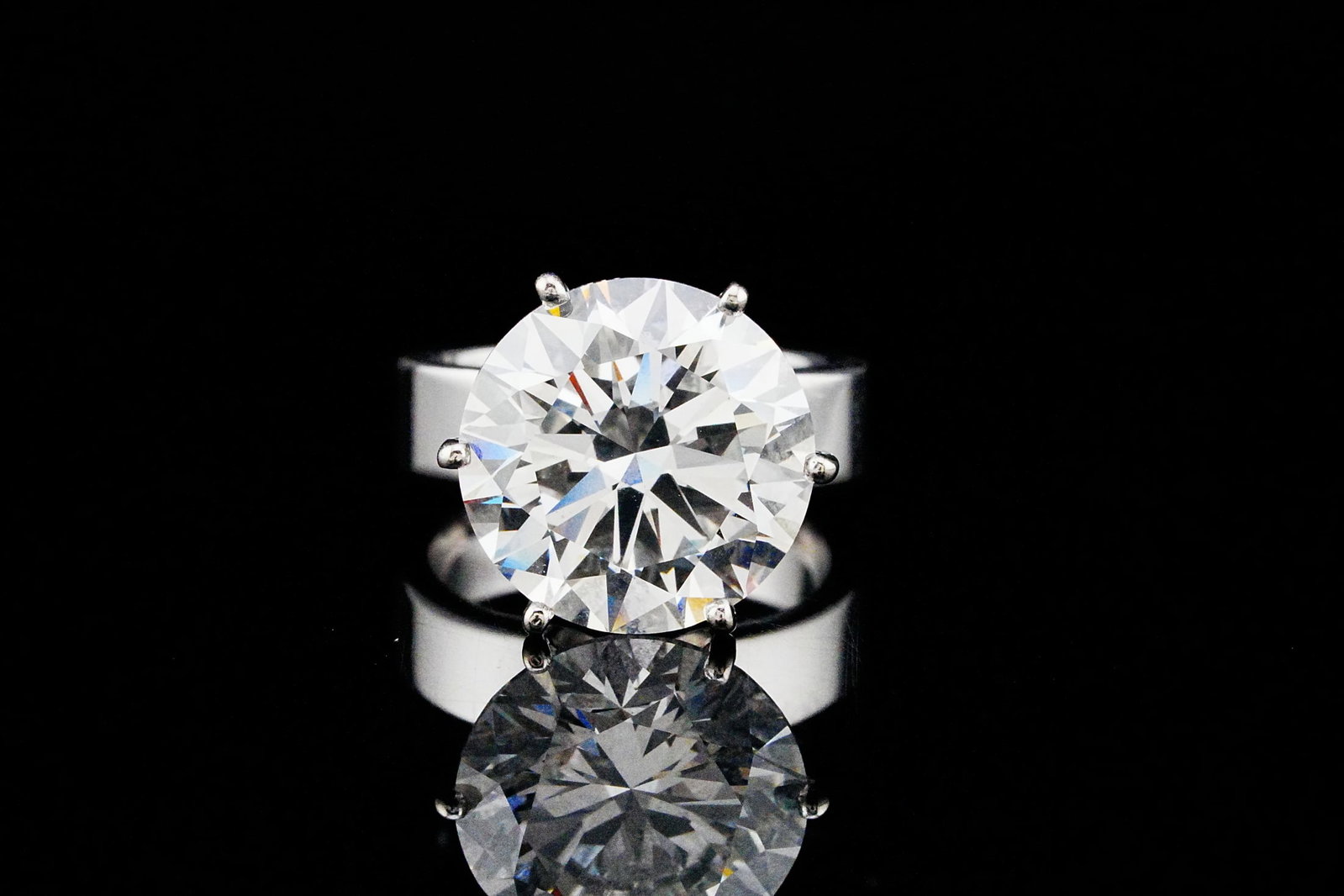 10.21ct VVS1/D-E Lab Grown Diamond & Solid 18k 5mm Band: This stunning ring features a massive 10.21ct VVS1 lab grown diamond solitaire and is set in a custom, solid 18k 5mm wide band. The lab grown diamond is delicately secured with a customized 6-prong se