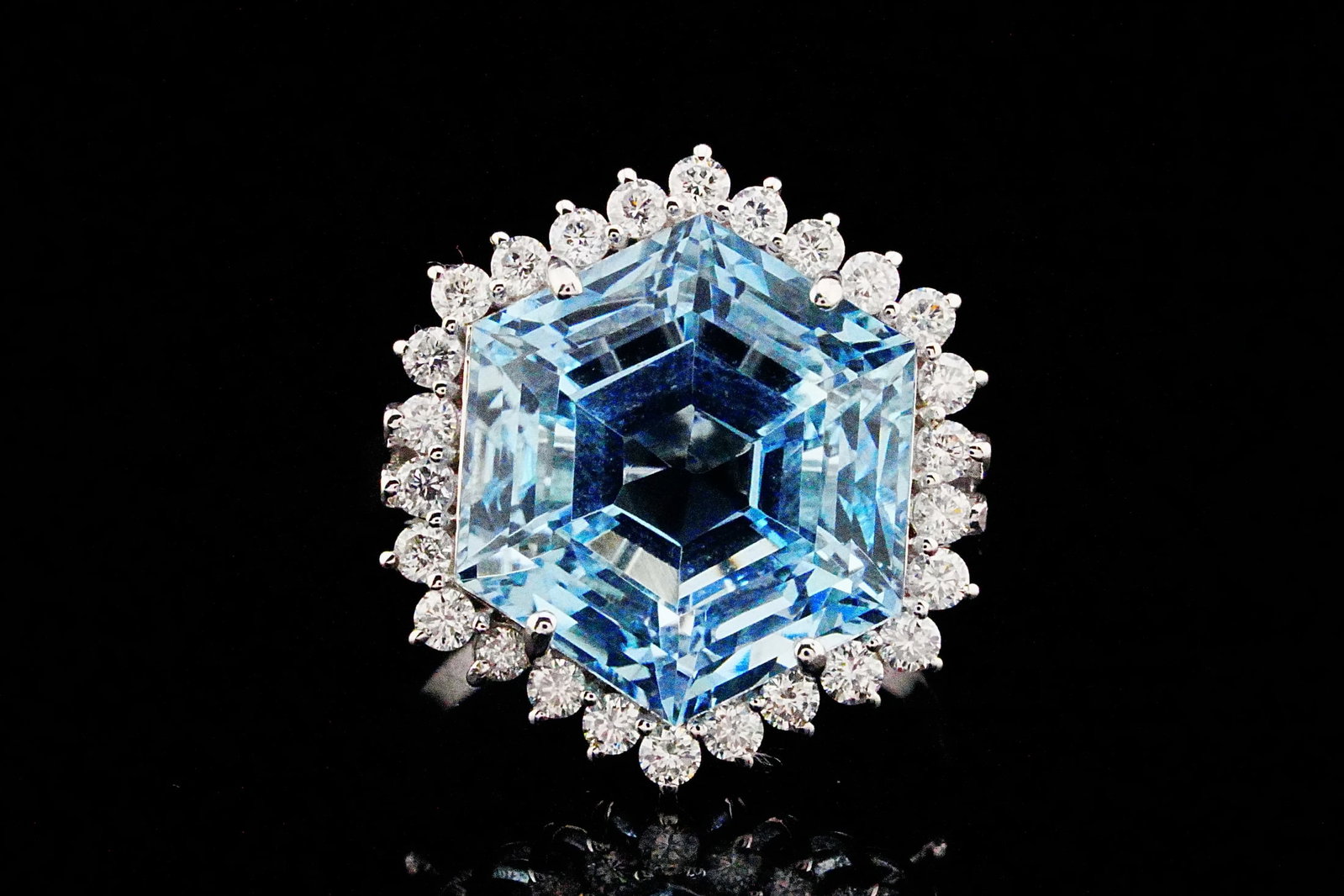 11.25ct Aquamarine, 0.65ctw Diamond and 18K Ring: 11.25ct Aquamarine, 0.65ctw VS2-SI1/G-H Diamond and 18K White Gold Geometric Halo Ring - THIS ITEM WILL COME WITH A $21,000 INSURANCE VALUATION REPORT. A sophisticated expression of contemporary elega