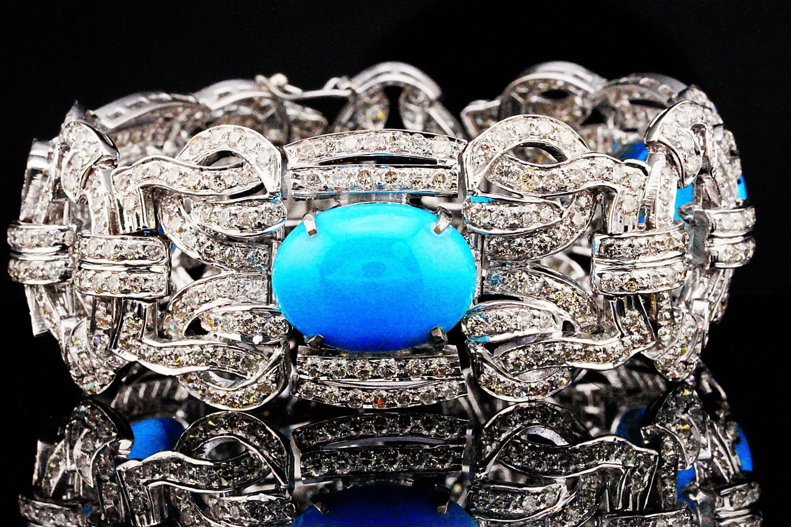 22.40ctw Turquoise, 15.10ctw Diamond and 18K Bracelet: 22.40ctw Turquoise, 15.10ctw VS1-SI1/G-H Diamond and 18K White Gold 7.5" Deco-Style Bracelet - THIS ITEM WILL COME WITH A $70,000 INSURANCE VALUATION REPORT. A striking Art Deco-inspired statement bra