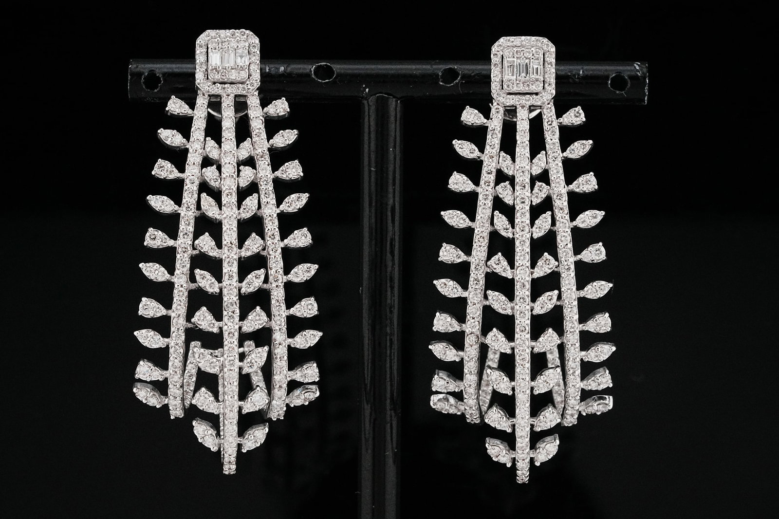 4.25ctw VS1-SI1/G-H Diamond and 18K White Gold Earrings: 4.25ctw VS1-SI1/G-H Diamond and 18K White Gold 2" Foliate Earrings - THIS ITEM WILL COME WITH A $28,000 INSURANCE VALUATION REPORT. An exceptional expression of modern elegance, these striking foliate