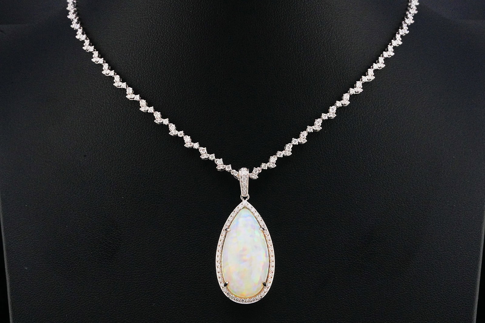 20.35ct Opal, 4.00ctw Diamond and 18K 16" Necklace: 20.35ct Opal, 4.00ctw VS1-SI1/G-H Diamond and 18K White Gold 16" Pendant Vine Necklace - THIS ITEM WILL COME WITH A $28,000 INSURANCE VALUATION REPORT. A spectacular statement necklace centered around