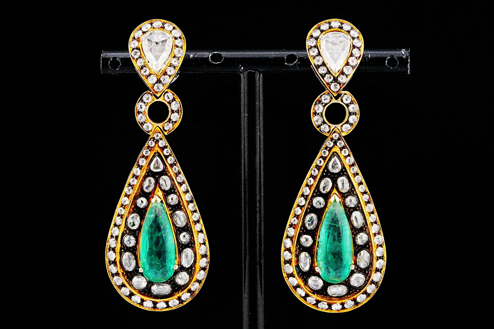 9.10ctw Emerald, 5.00ctw Diamond and 18K 2.25" Earrings: 9.10ctw Emerald, 5.00ctw Rose Cut Diamond and 18K White/Yellow Gold 2.25" Polki-Style Drop Earrings - THIS ITEM WILL COME WITH A $23,500 INSURANCE VALUATION REPORT. A striking celebration of old-world